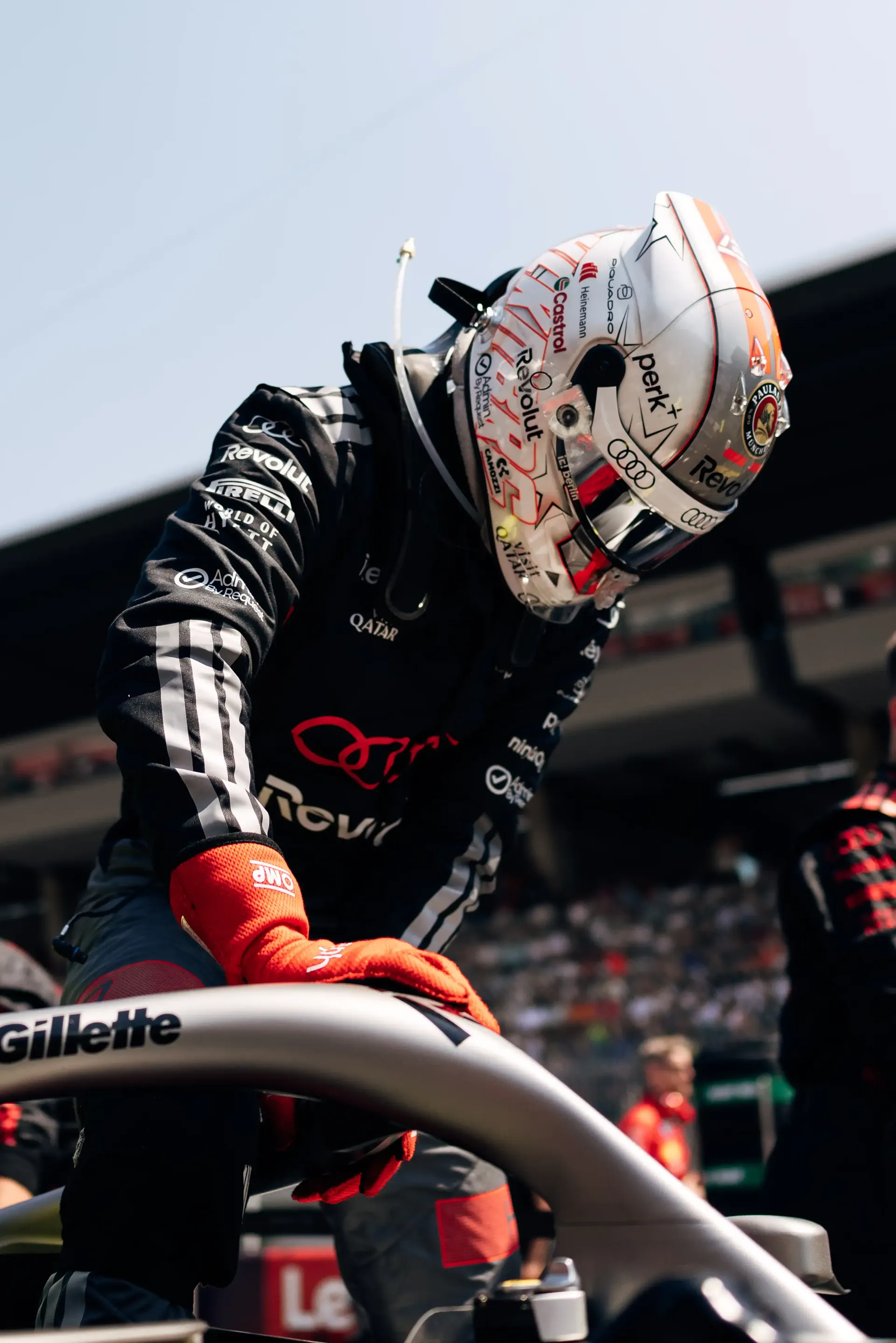 Nico Hulkenberg prepares to enter the cockpit of the Audi Revolut F1® Team R26 before the race at the Formula 1® Austrian Grand Prix at the Red Bull Ring.
