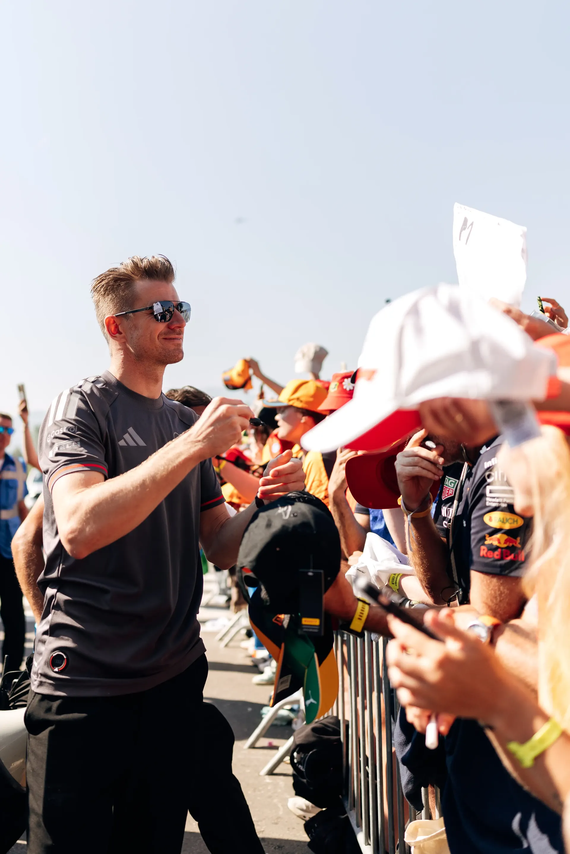 Nico Hulkenberg signs autographs for fans during the traditional Austrian welcome before the Formula 1® Austrian Grand Prix in Spielberg before the race.