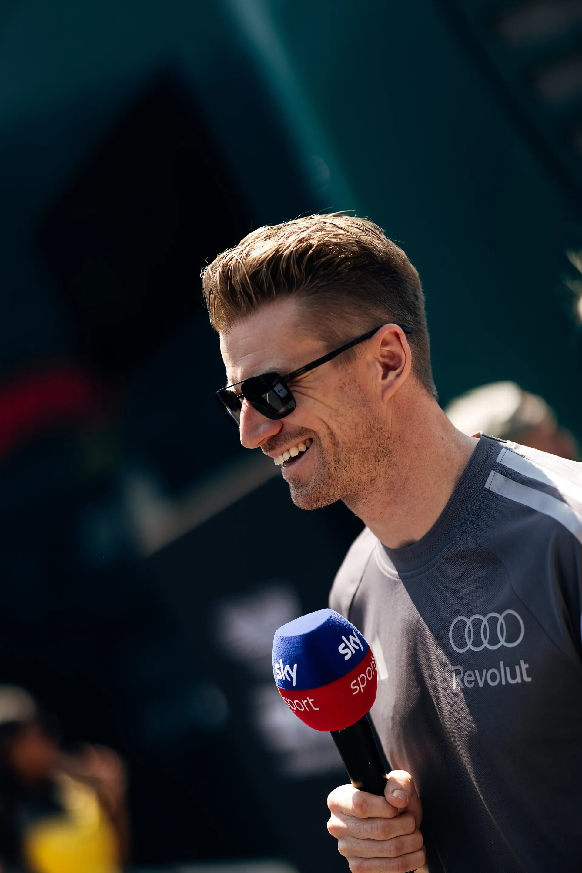 Nico Hulkenberg is interviewed ahead of the Formula 1 Drivers' Parade before the Austrian Grand Prix in Spielberg.