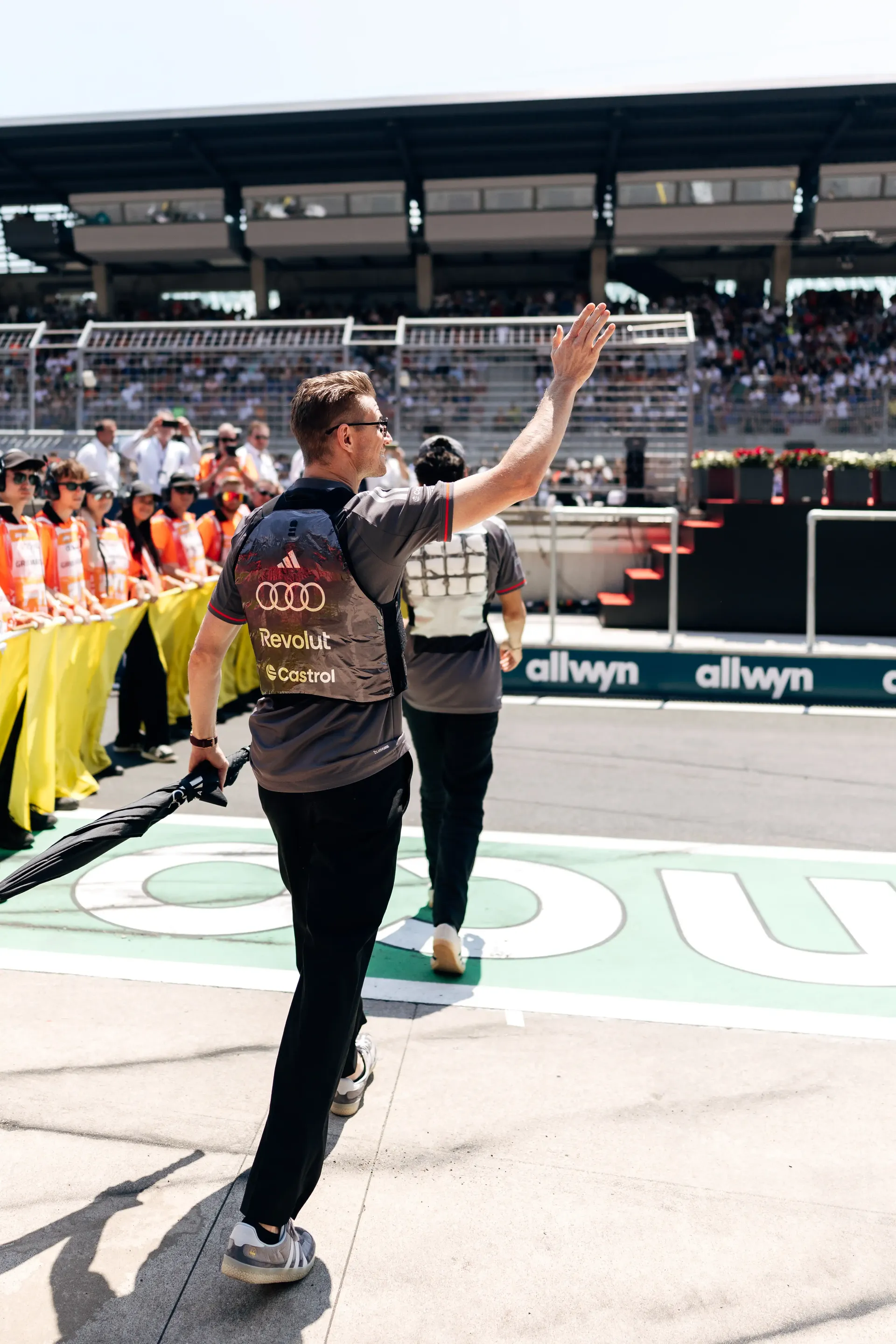 Nico Hulkenberg waves to fans during the Formula 1 Drivers' Parade before the Austrian Grand Prix in Spielberg.