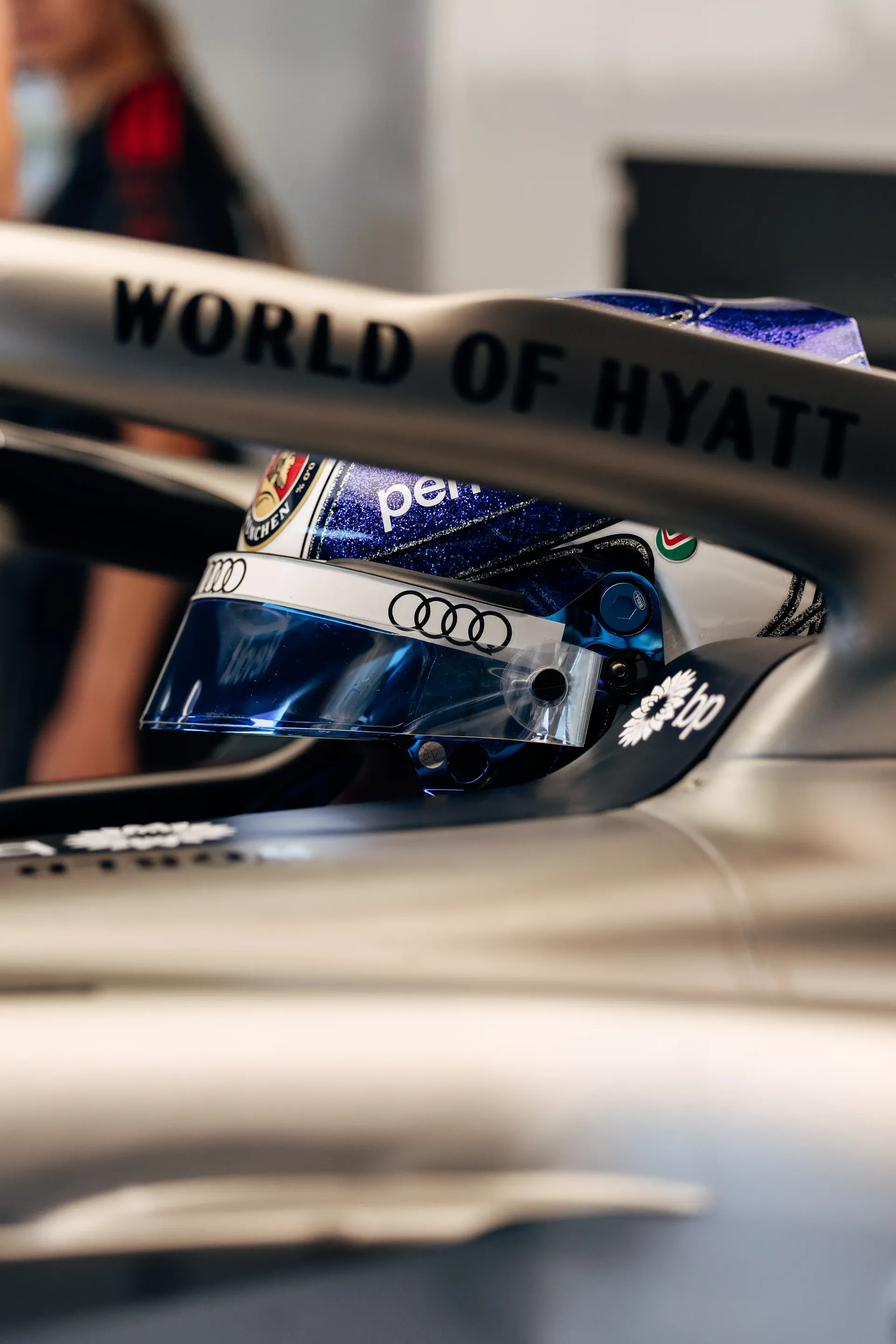 Helmet Close-up shot of Paul Aron driver at the Audi Revolut F1® Team inside the cockpit in FP1 at Spielberg, featuring the front wing and nose detail as it sits in the garage area ahead of running at the Austrian Grand Prix.