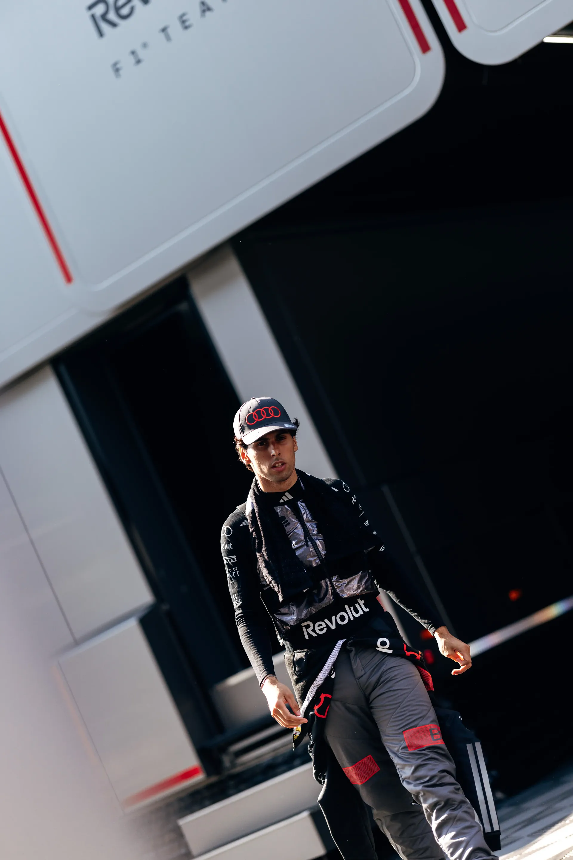 Gabriel Bortoleto walking through the Audi Revolut F1® Team paddock during FP2 at the Austrian Grand Prix in Spielberg, Austria.