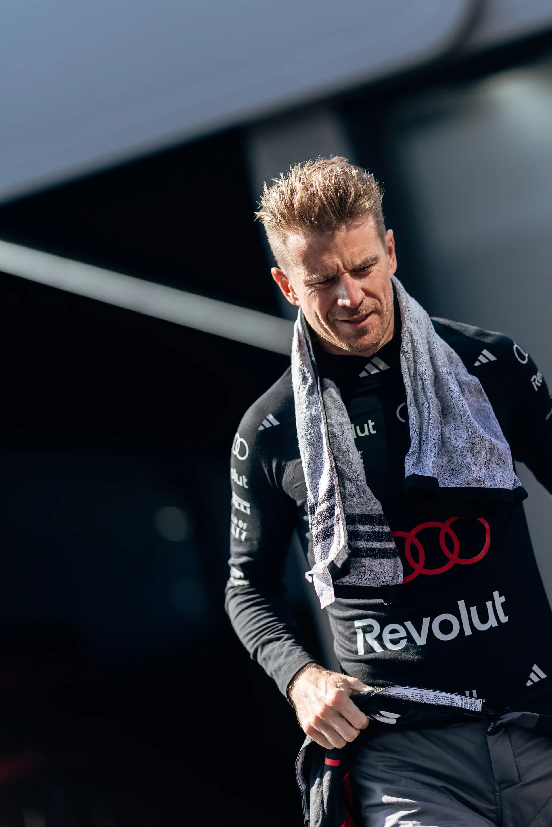 Nico Hulkenberg dirver at the Audi Revolut F1® Team driver with a towel over his shoulder outside the garage during FP2 at the Austrian Grand Prix.