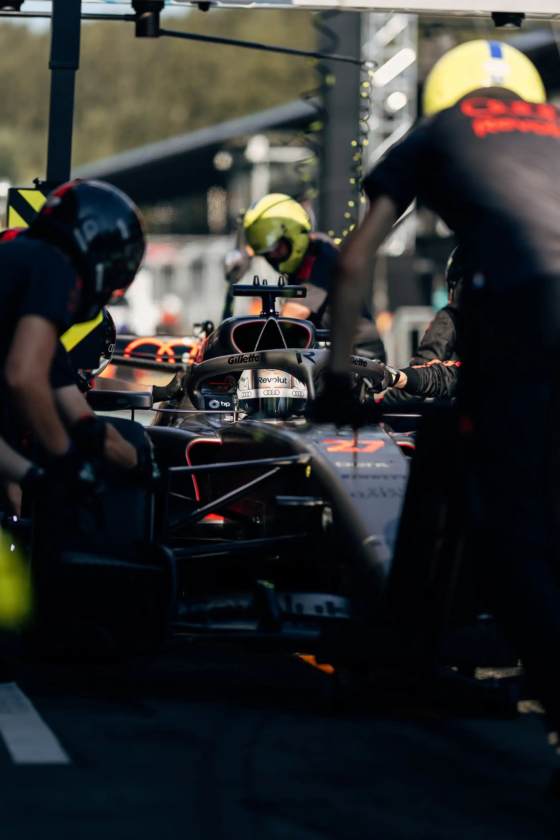 Audi Revolut F1® Team mechanics working on the Audi R26 in the pit stop during FP2 at Spielberg.