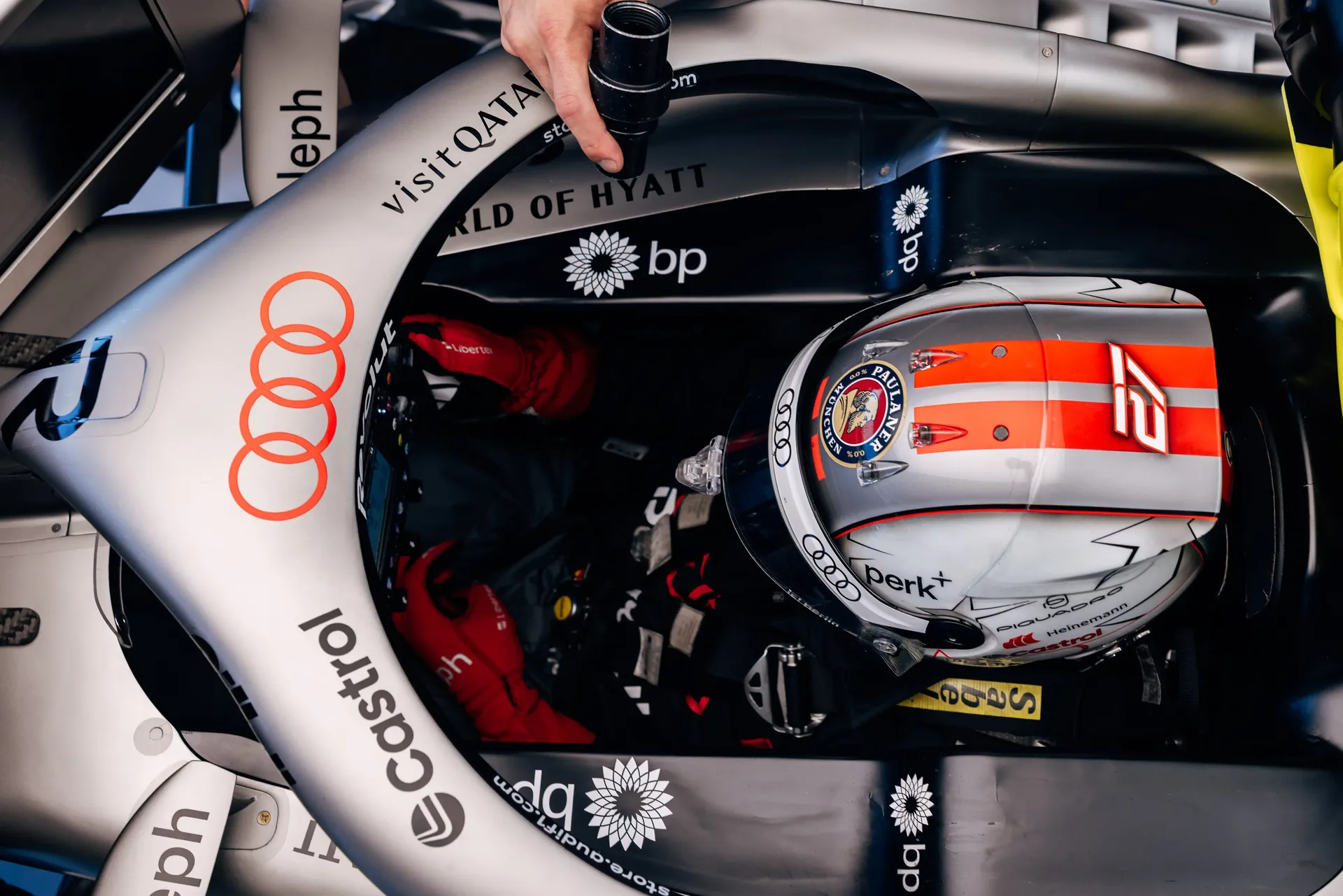 Top-down view of Nico Hulkenberg driver at the Audi Revolut F1® Team strapped into the cockpit during FP2 at the Austrian Grand Prix.