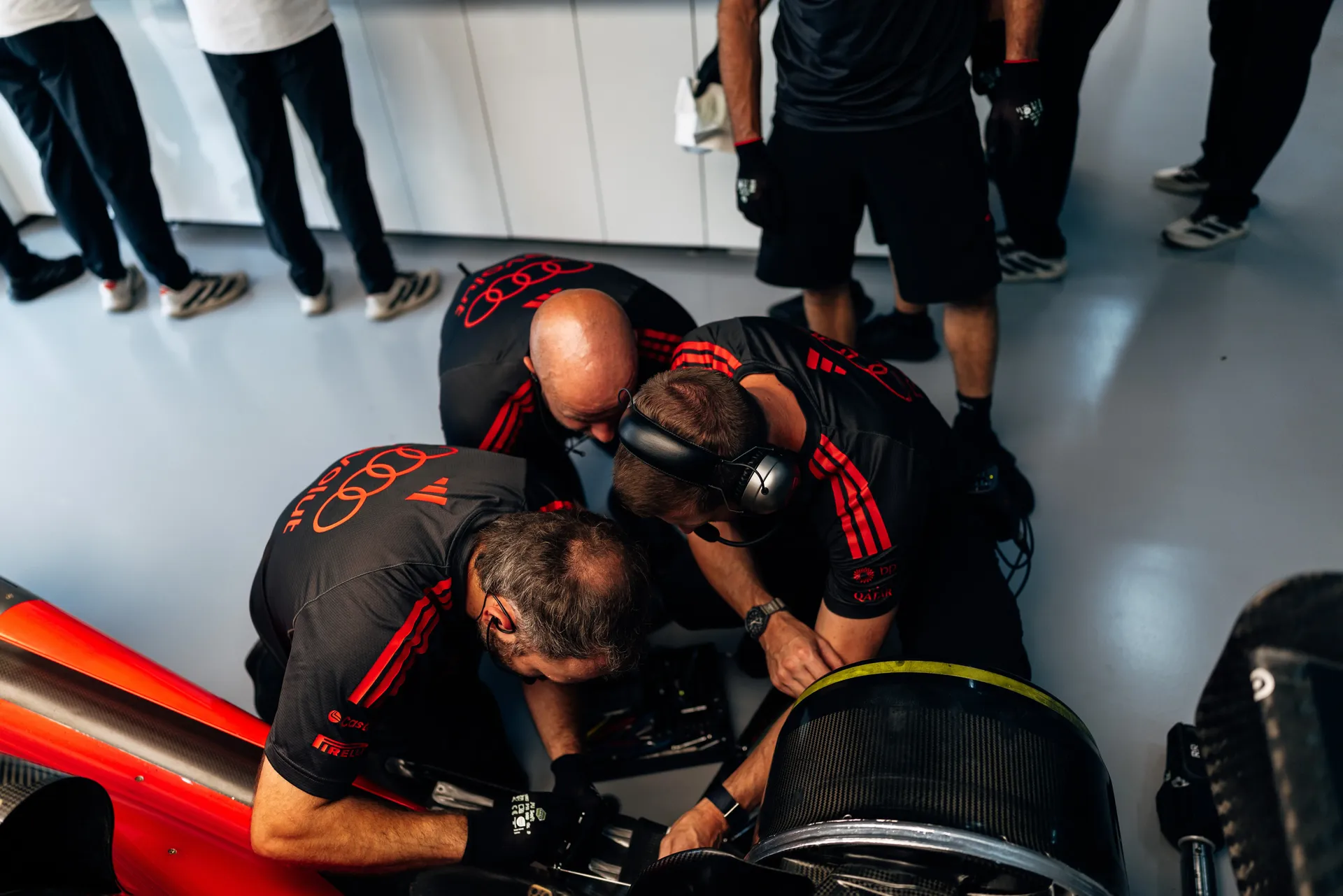 Audi Revolut F1® Team mechanics working on the Audi R26