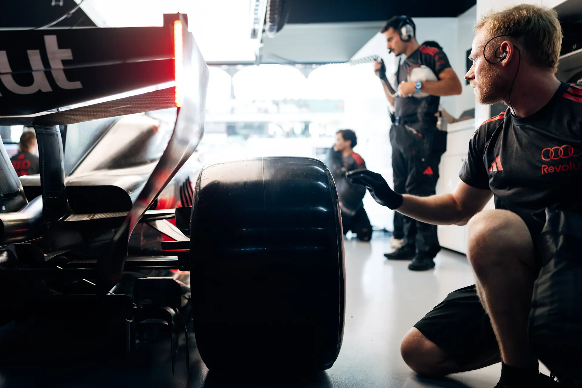 Audi Revolut F1® Team mechanic working on the Audi R26