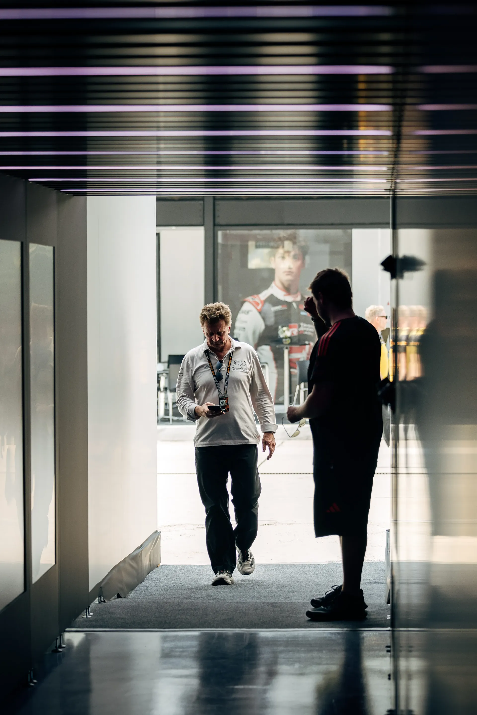Audi Revolut F1® Team racing director Allan McNish walking through the paddock