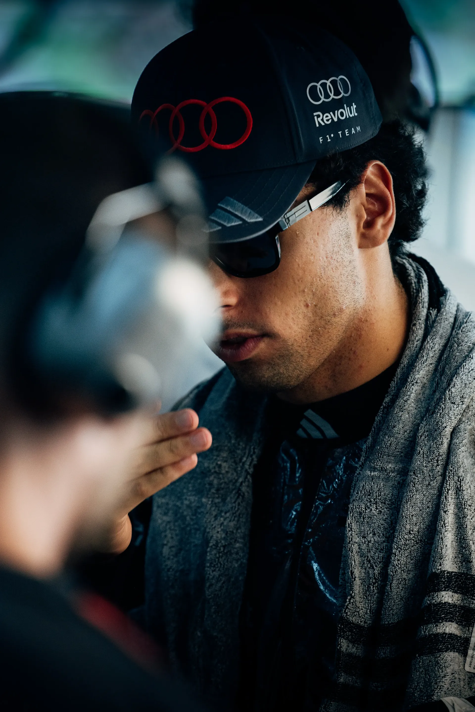 Close up of Gabriel Bortoleto driver at Audi Revolut F1® Team in the garage
