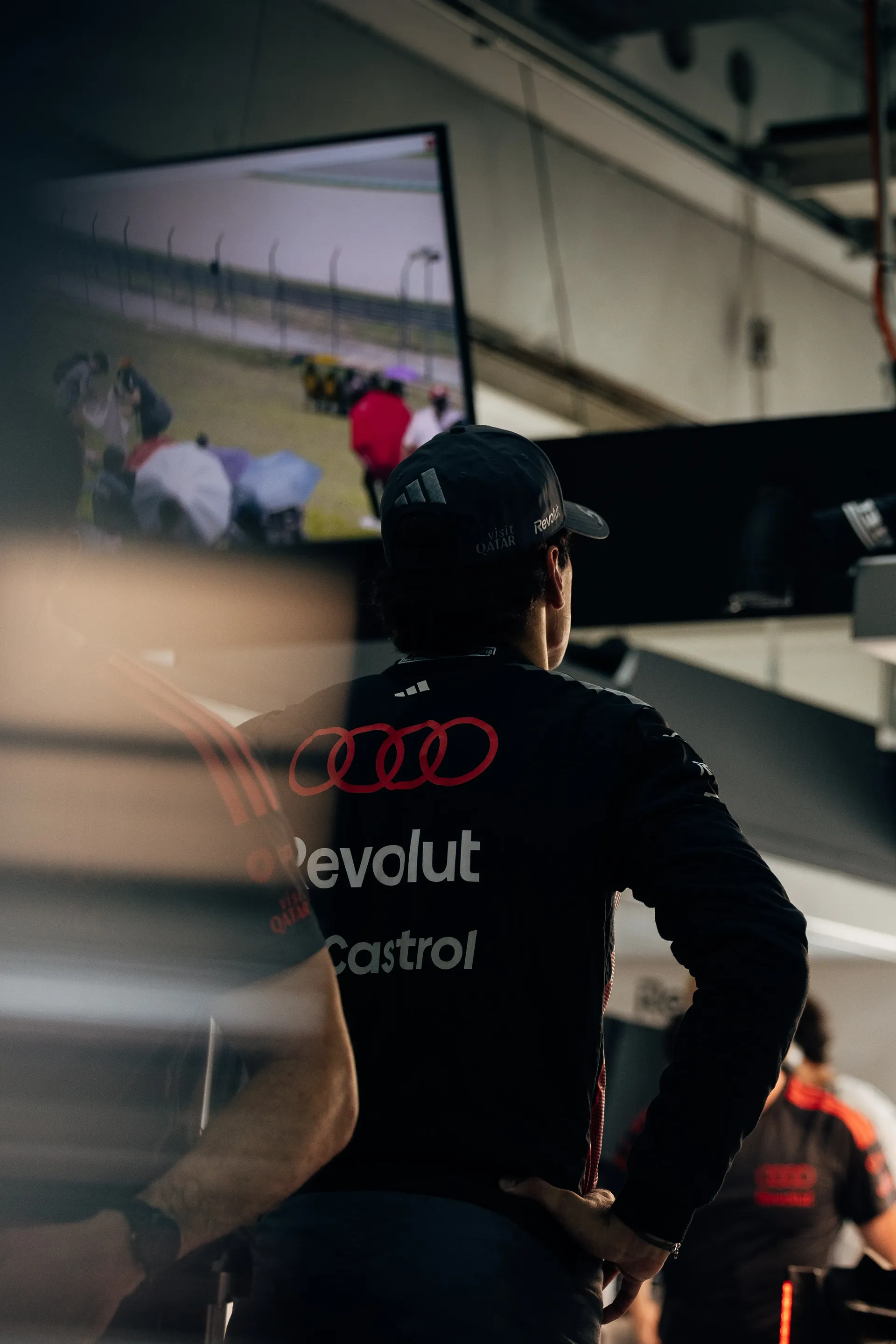 Back shot of Gabriel Bortoleto driver at Audi Revolut F1® Team in the garage
