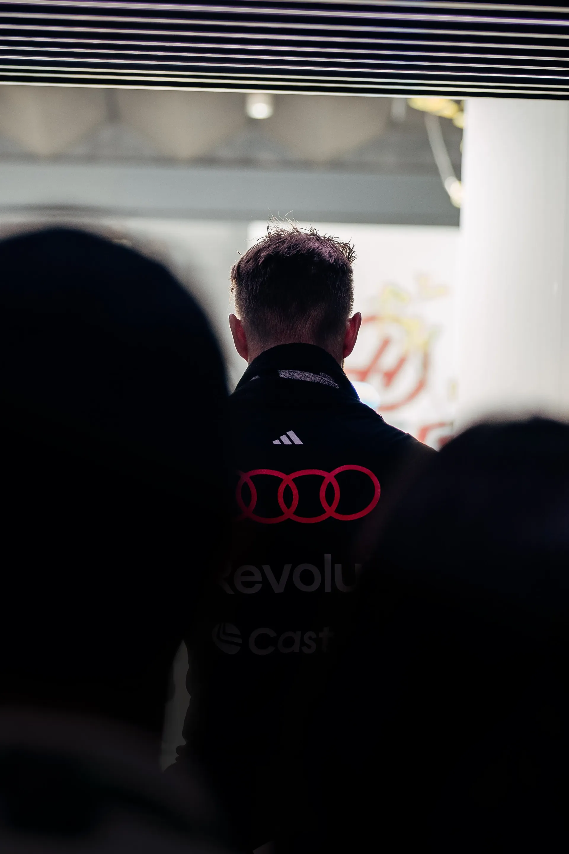 Back shot of Nico Hulkenberg driver at Audi Revolut F1® Team in the garage
