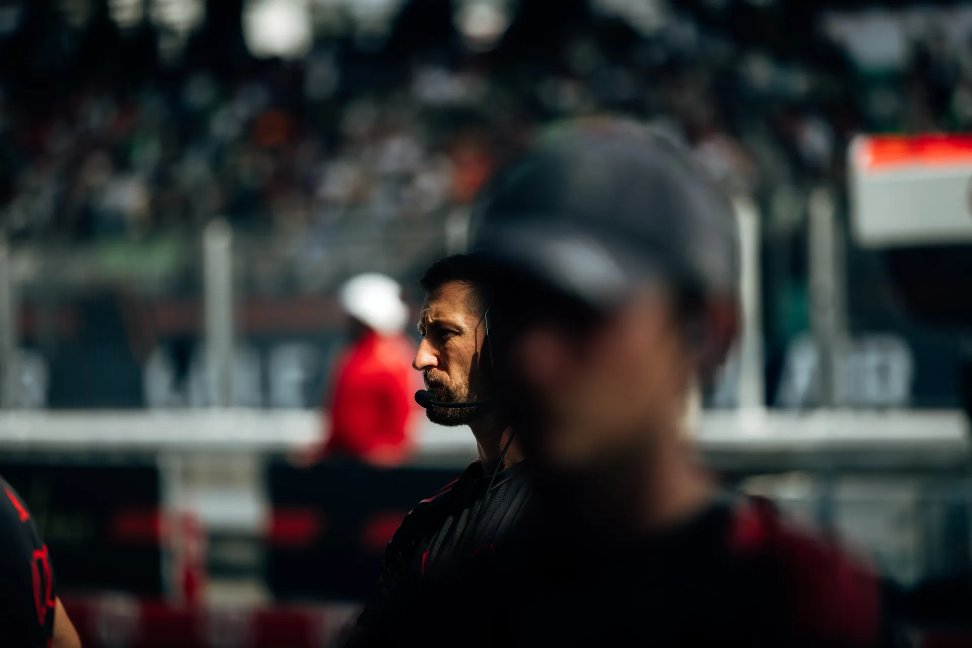 Close up of Audi Revolut F1® Team team mechanic in front of the garage