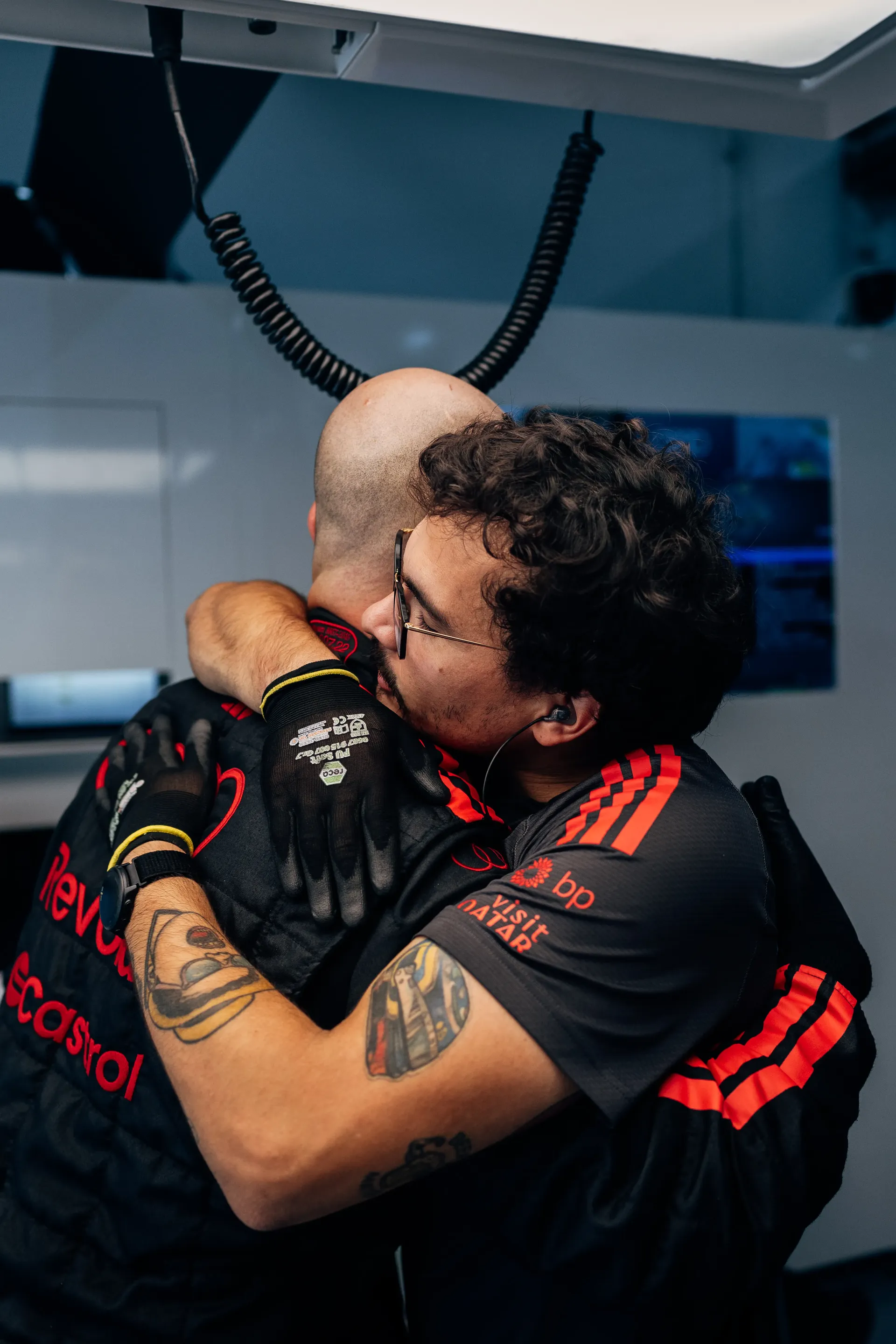 Audi Revolut F1® Team team mechanics embracing in the garage