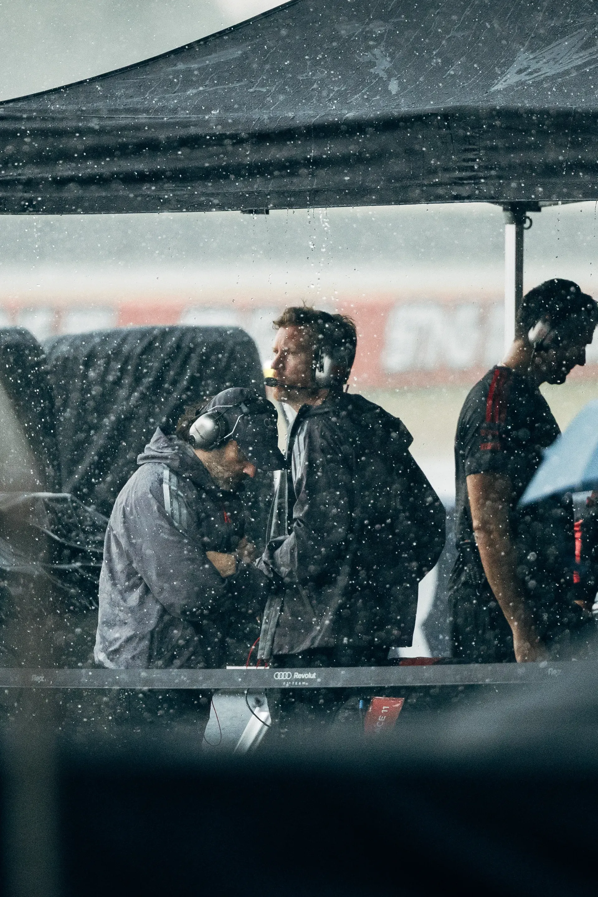 Audi Revolut F1® Team members watching the race in the rain