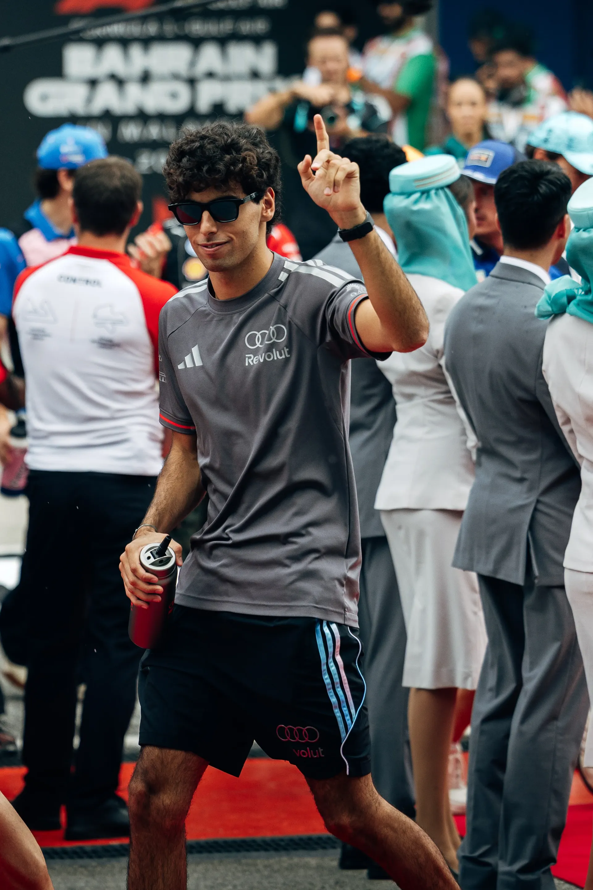 Audi Revolut F1® Team driver Gabriel Bortoleto walking through the paddock