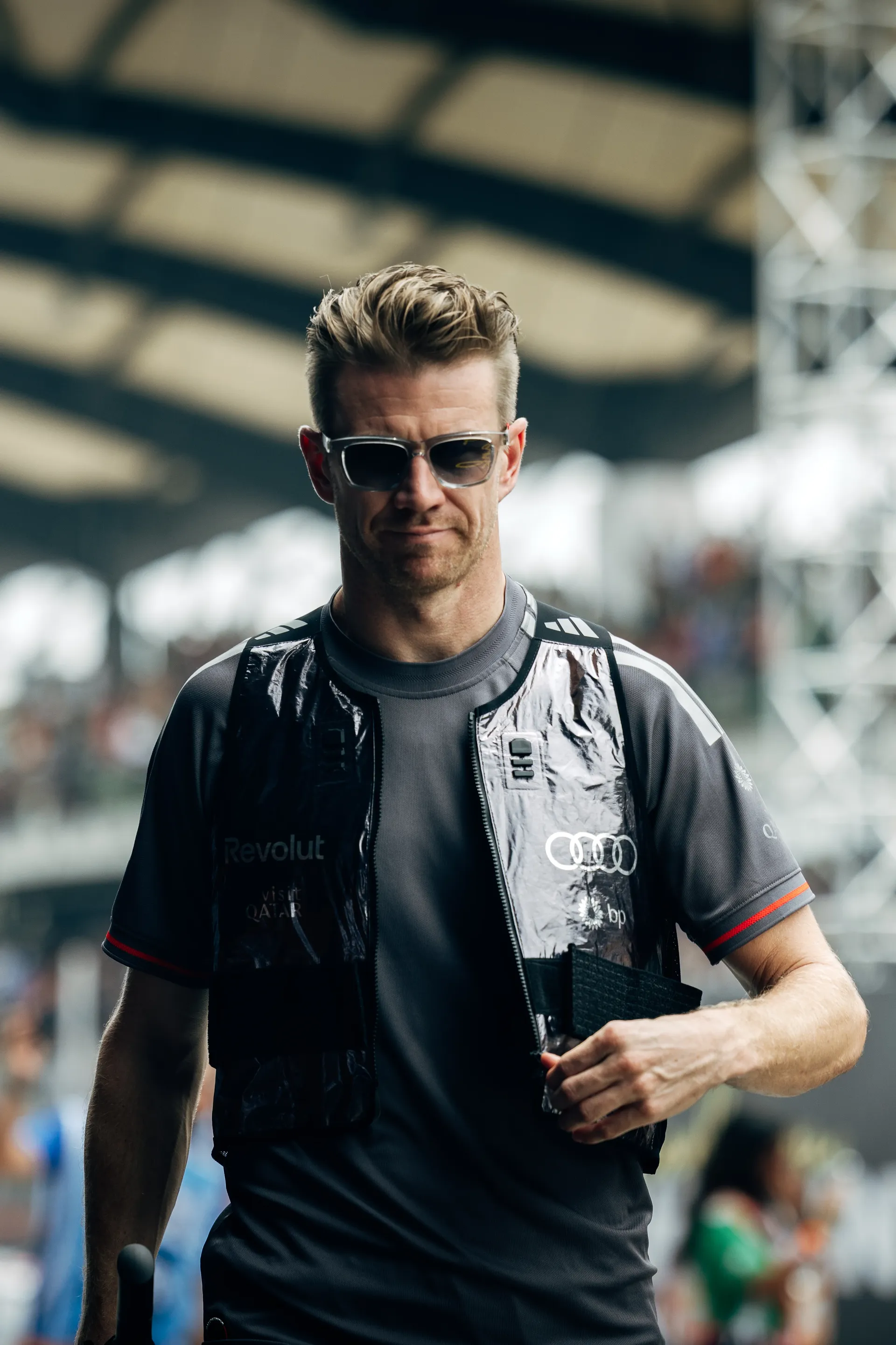 Audi Revolut F1® Team driver Nico Hulkenberg walking through the paddock