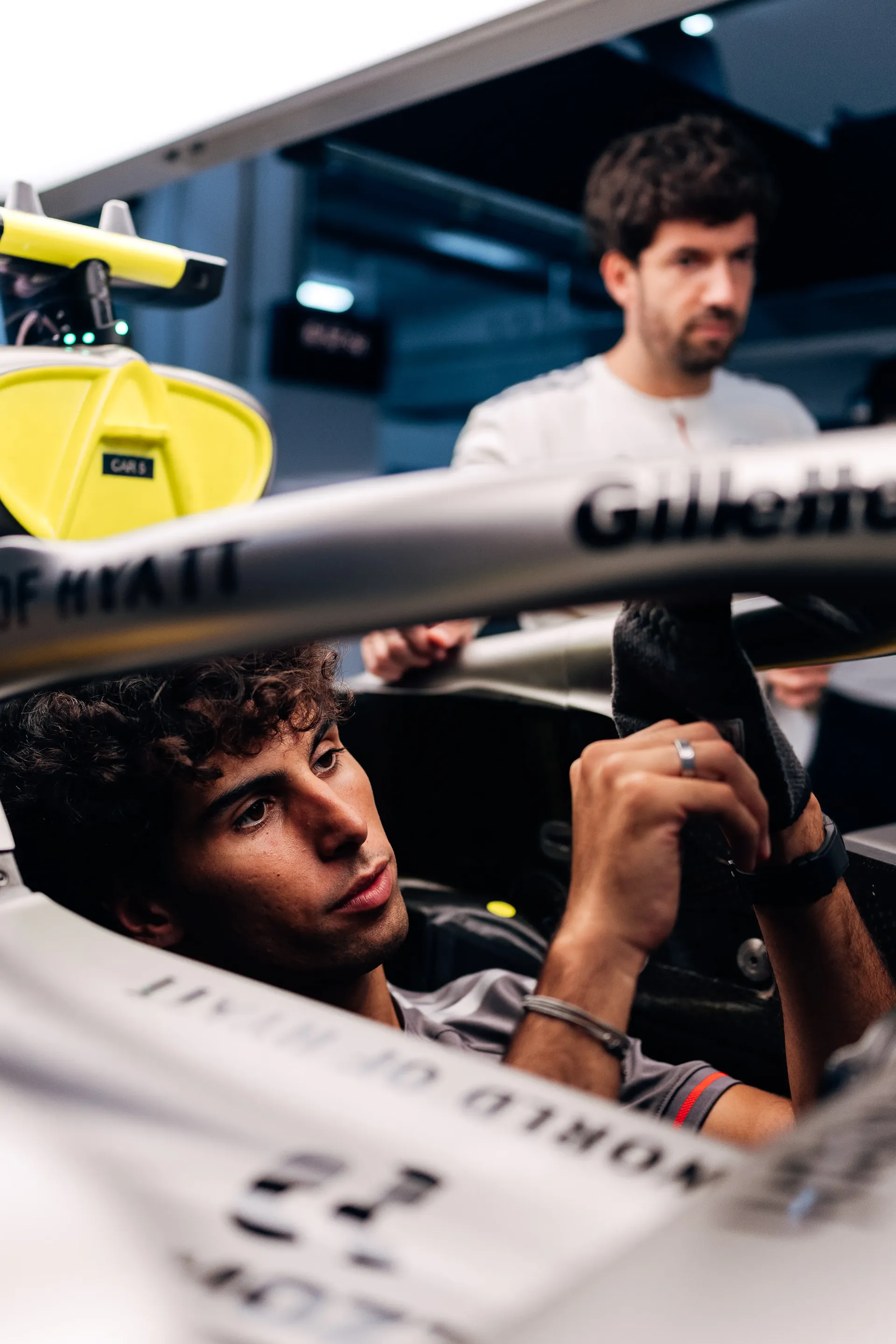 Audi Revolut F1® Team driver Gabriel Bortoleto seated in the Audi R26 cockpit during a seat check