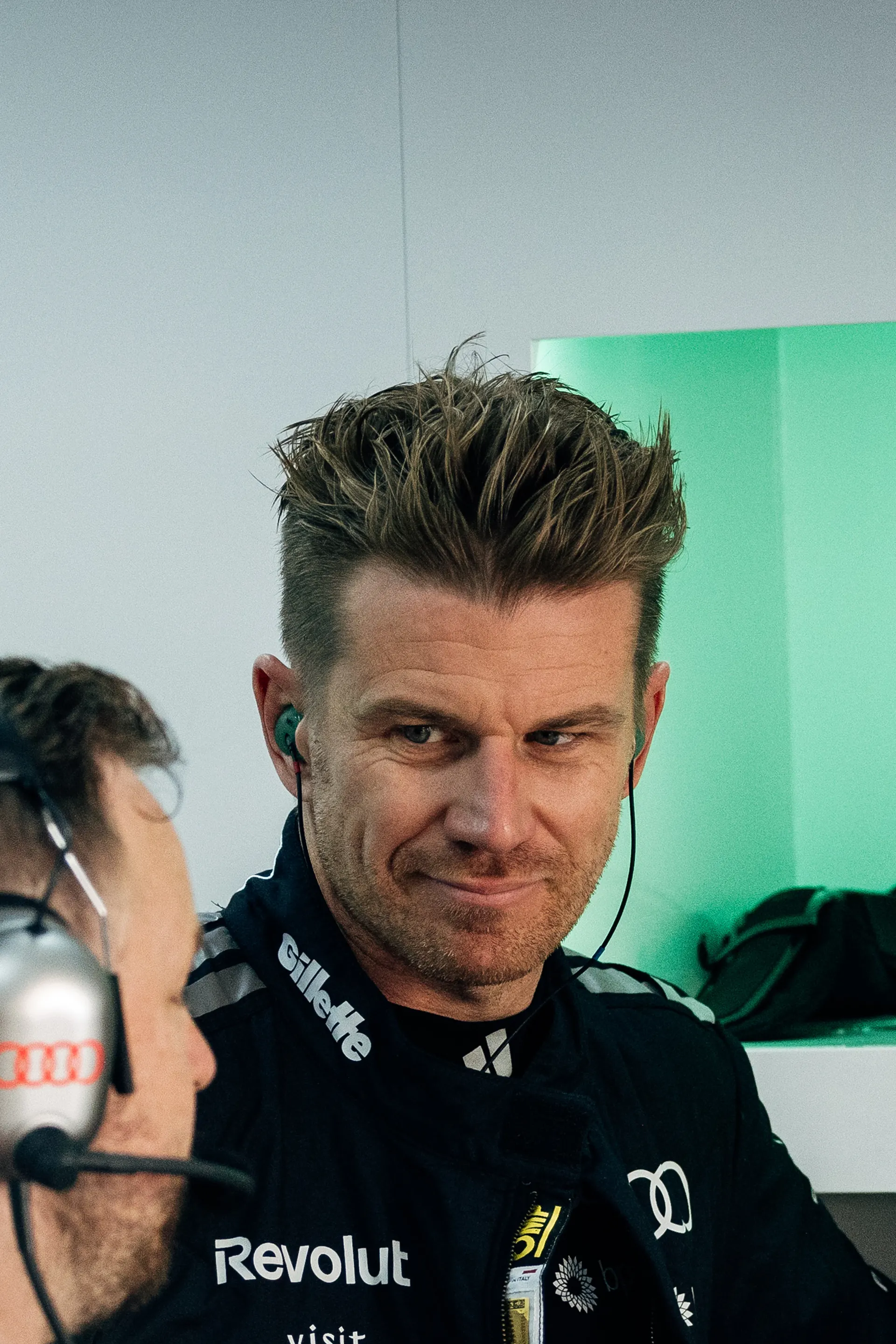 Close Up of the Audi Revolut F1® Team driver Nico Hulkenberg talking to team engineer in the garage