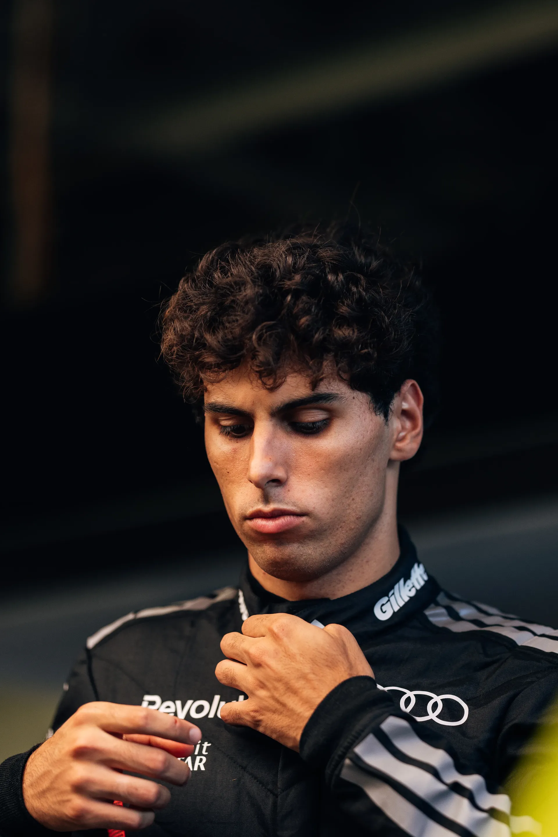 Close Up of the Audi Revolut F1® Team driver Gabriel Bortoleto getting ready in the garage