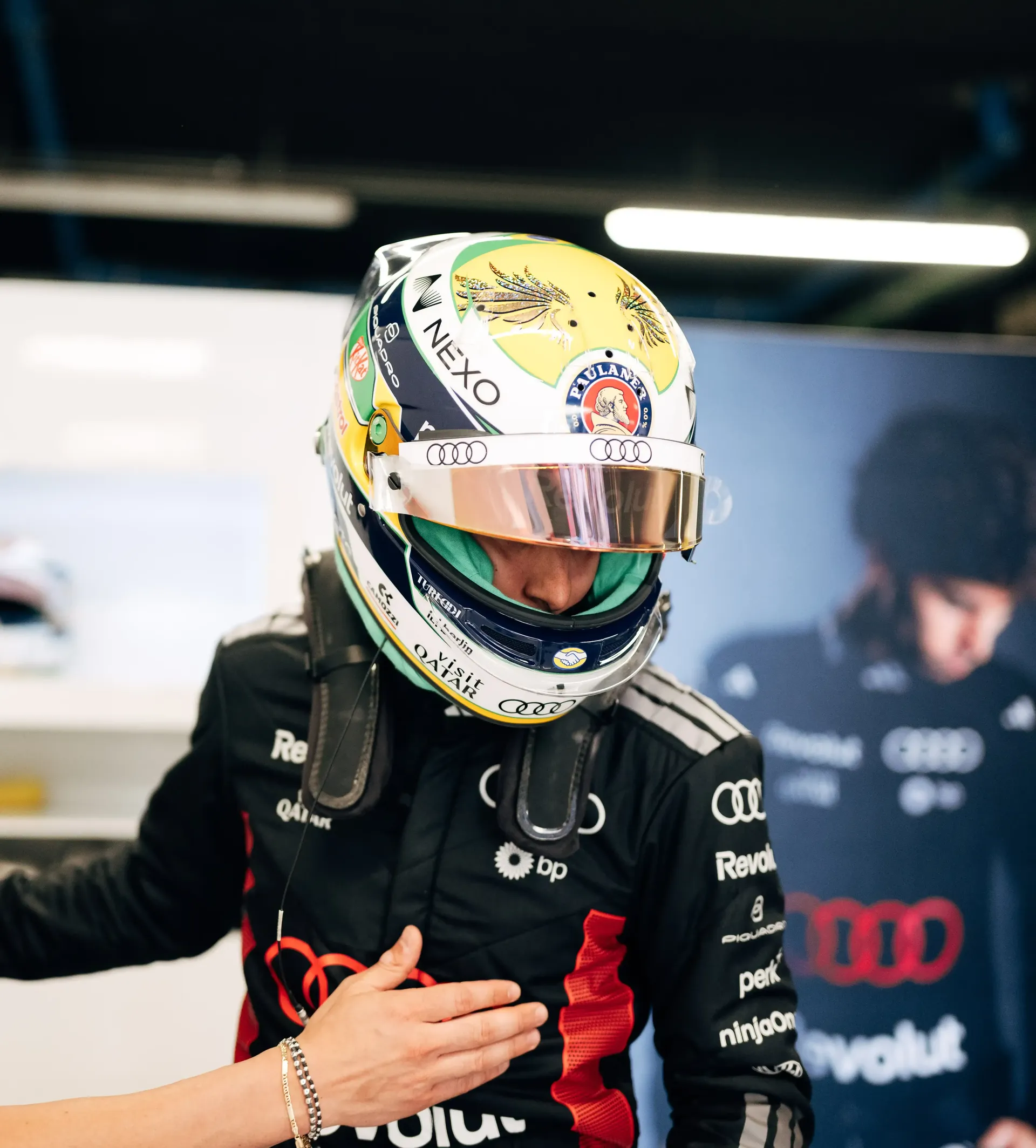 Gabriel Bortoleto driver at the Audi Revolut F1® Team inside the garagegreeting a crew member at the Barcelona Catalunya Grand Prix 2026