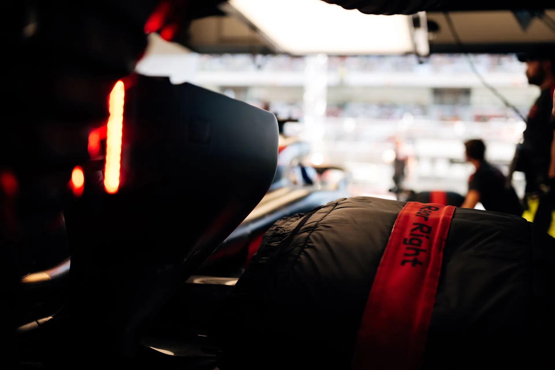 Detail shot of Audi Revolut F1® Team rear bodywork and tire blankets labeled “Right Rear,” highlighting pit preparation.