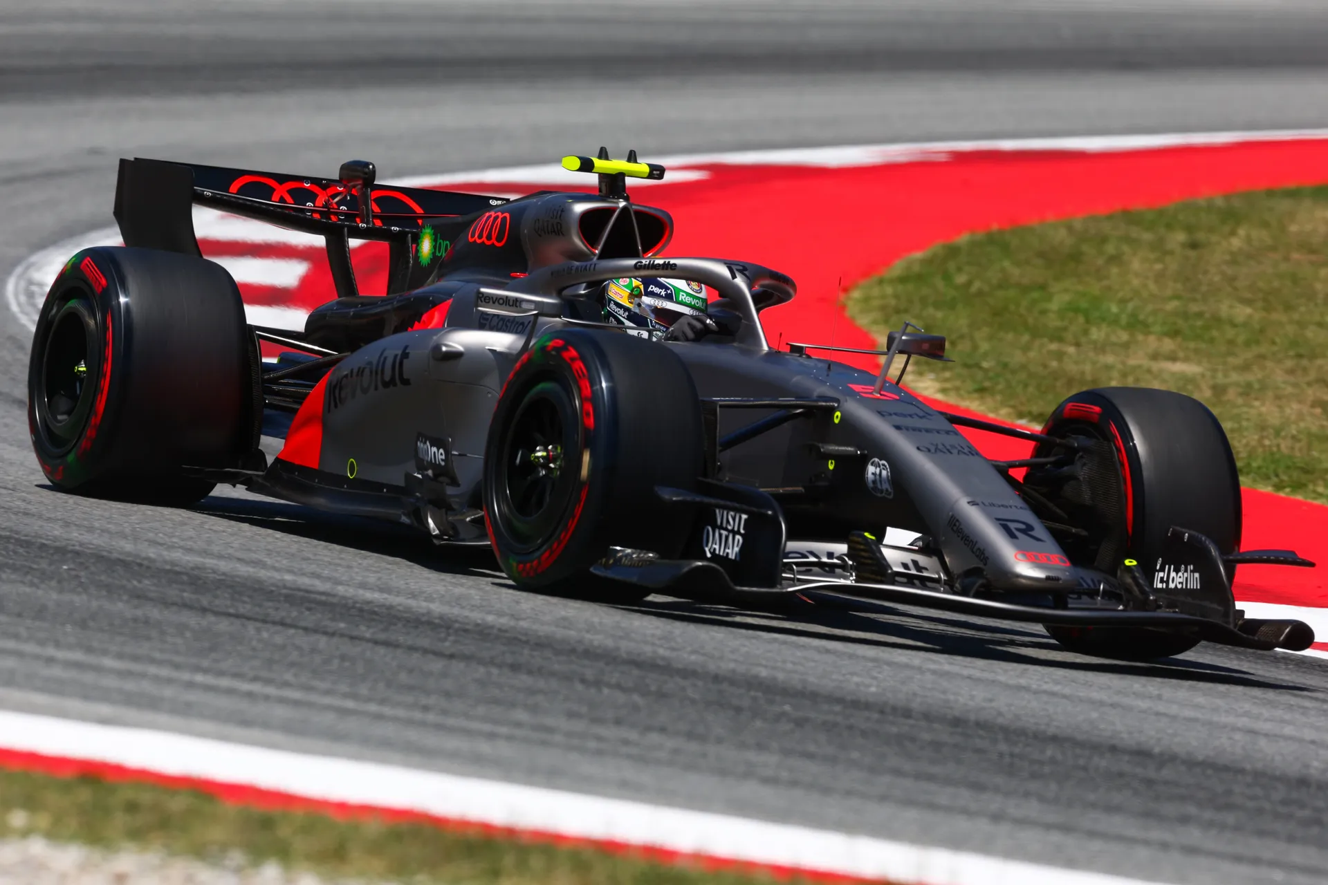 Gabriel Bortoleto driving Audi Revolut F1® Team car number 5 on soft tyres through a high-speed corner during qualifying at Circuit de Barcelona-Catalunya