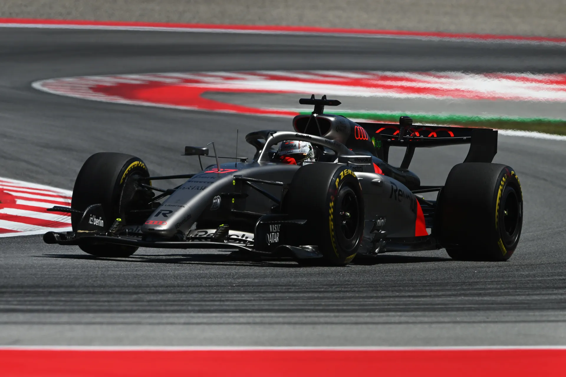 Nico Hulkenberg driving Audi Revolut F1® Team car number 27 on medium tyres through a corner during qualifying at Circuit de Barcelona-Catalunya