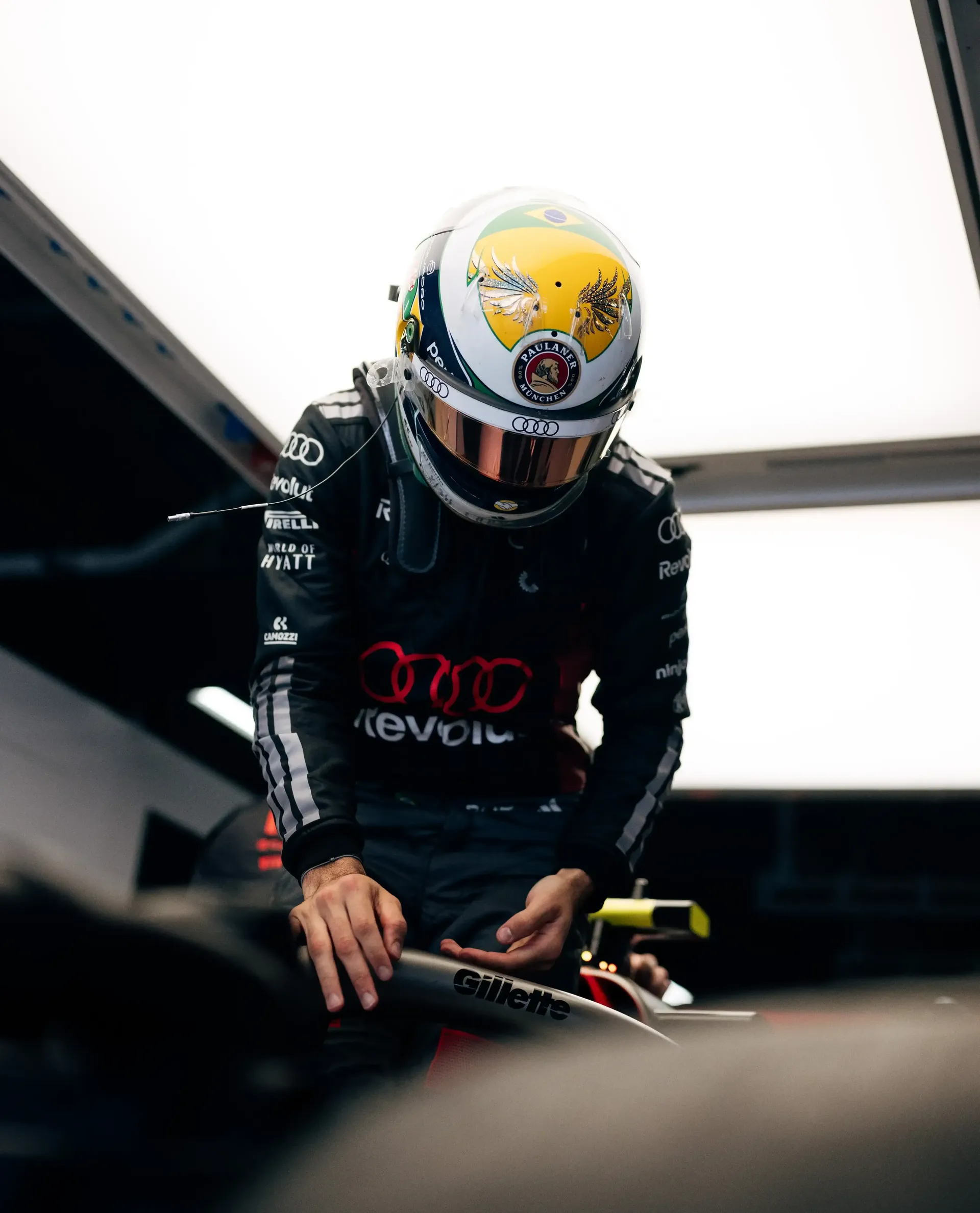 Gabriel Bortoleto driver at the Audi Revolut F1® Team jumping out of ther cockpit inside the garage at the Barcelona Catalunya Grand Prix 2026