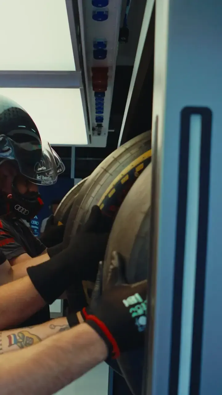 Audi Revolut F1® Team members prepare and operate trackside during the Belgian Grand Prix, capturing pre-race focus, garage activity and race day atmosphere.
