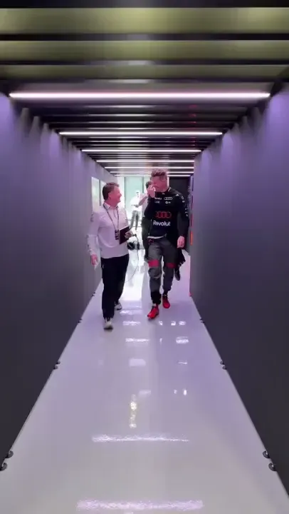 Nico Hulkenberg enters the car during FP3 at the Belgian Grand Prix, preparing for the session as the Audi Revolut F1® Team crew completes final checks.