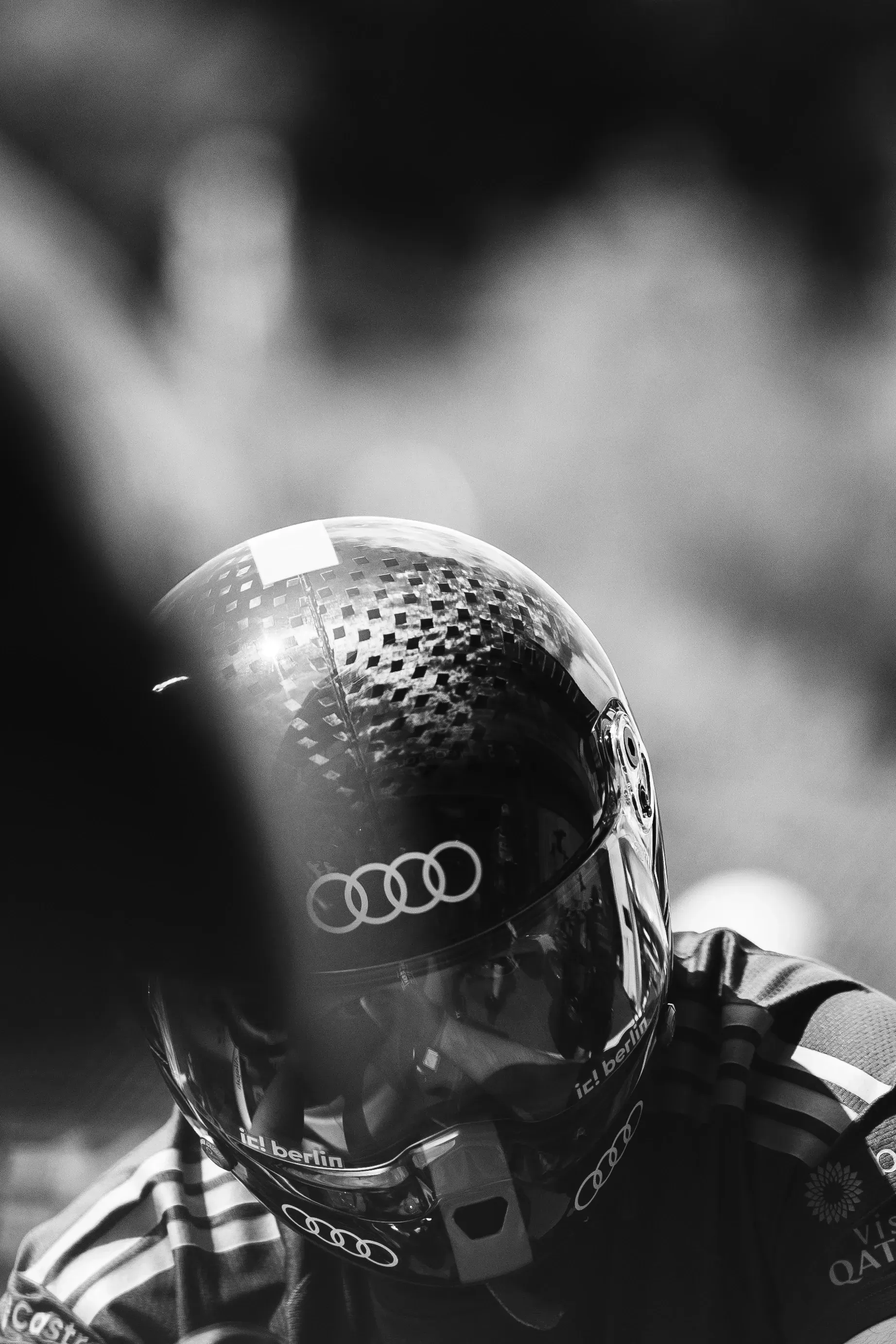 Close-up of team member preparing in the Audi Revolut F1® Team garage before going out on track.