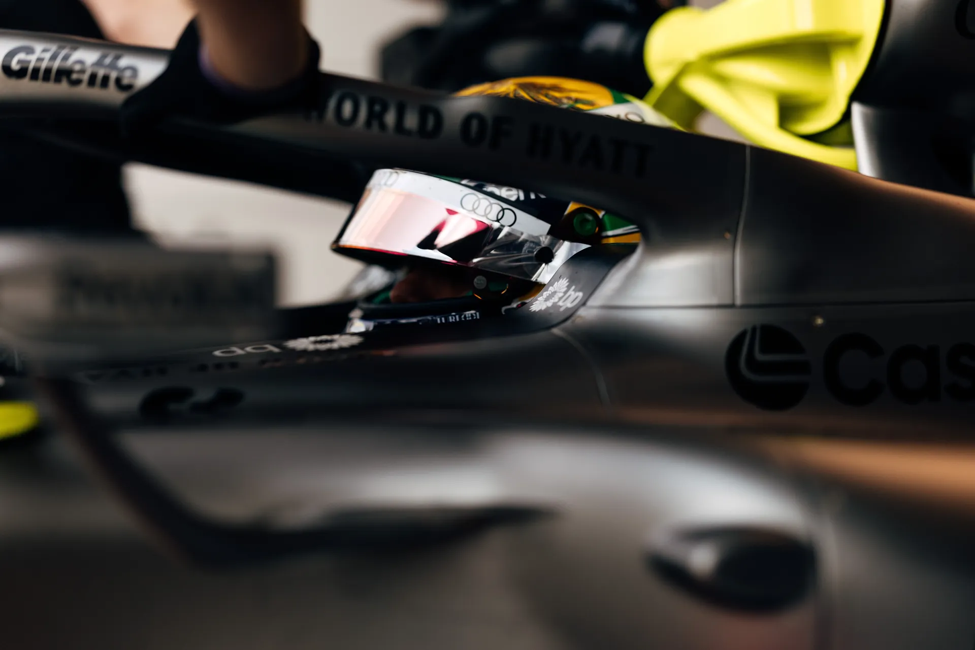 Gabriel Bortoleto sits in the Audi Revolut F1® Team car, readying for track action inside the garage.