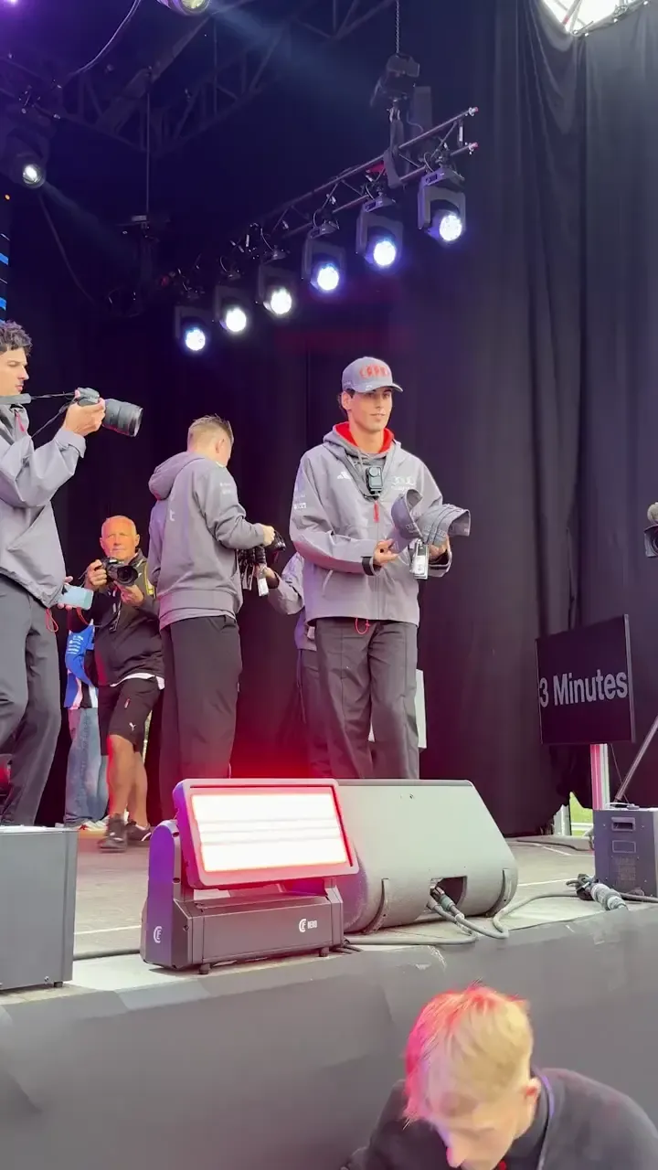 Gabriel Bortoleto and Nico Hulkenberg appear on stage at the Belgian Grand Prix fan forum for Audi Revolut F1® Team, engaging with a large crowd and interacting with fans.