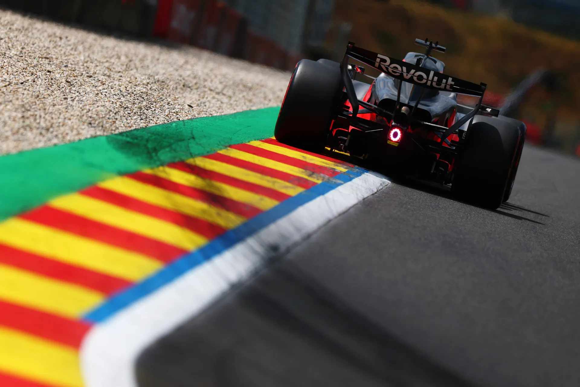 Rear view of Audi R26 of Audi Revolut F1® Team riding the kerbs showing tyres and rear light