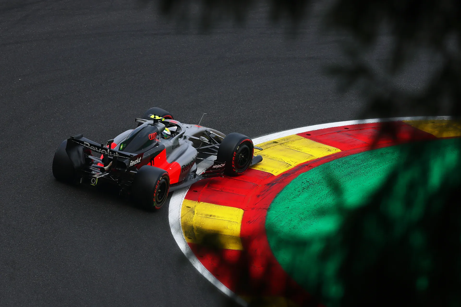 Audi Revolut F1® Team car driving over the red and yellow kerbs at Spa Francorchamps during qualifying
