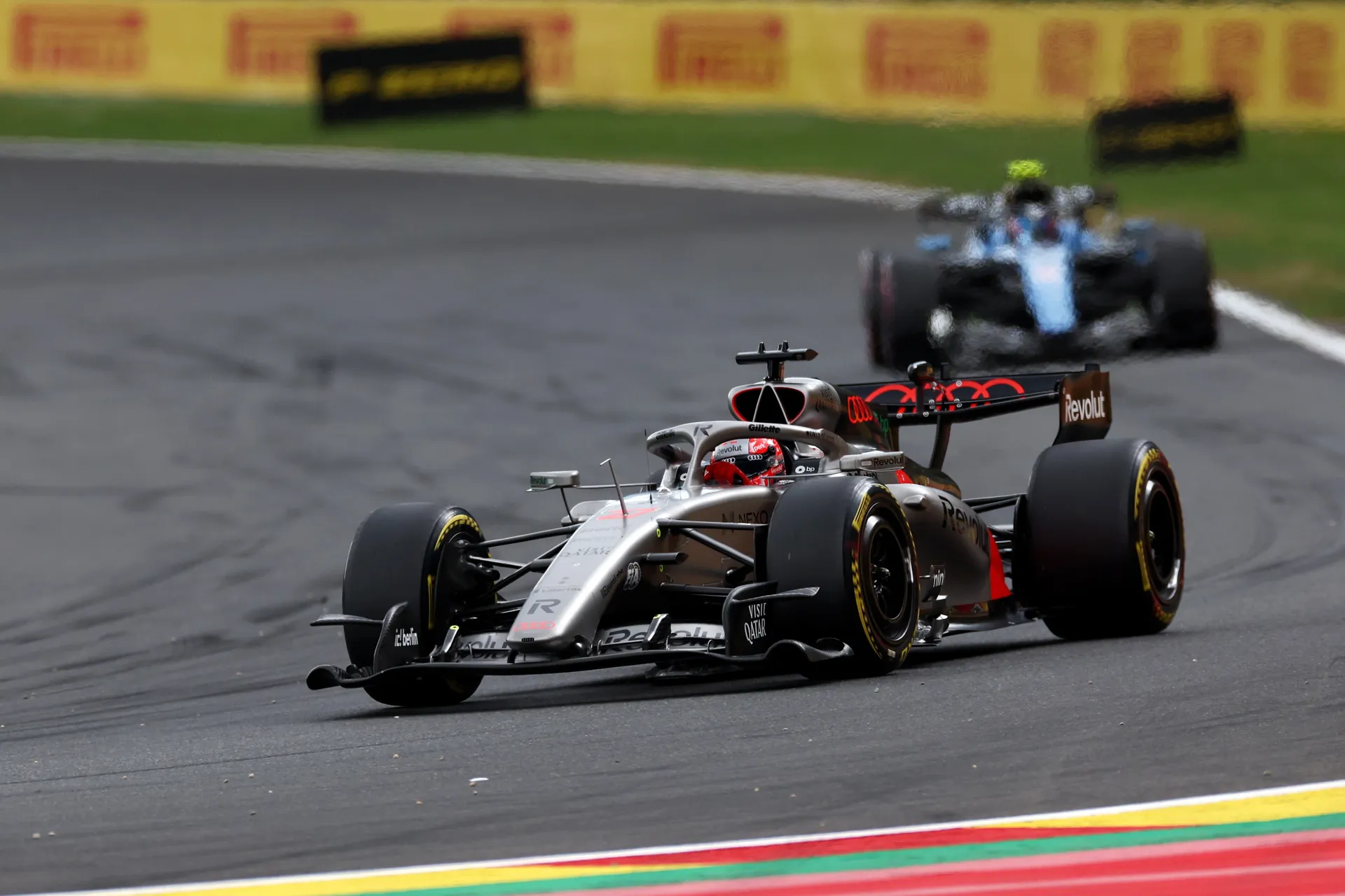 The Audi R26 runs at speed with another car close behind on track during the race at Spa-Francorchamps.
