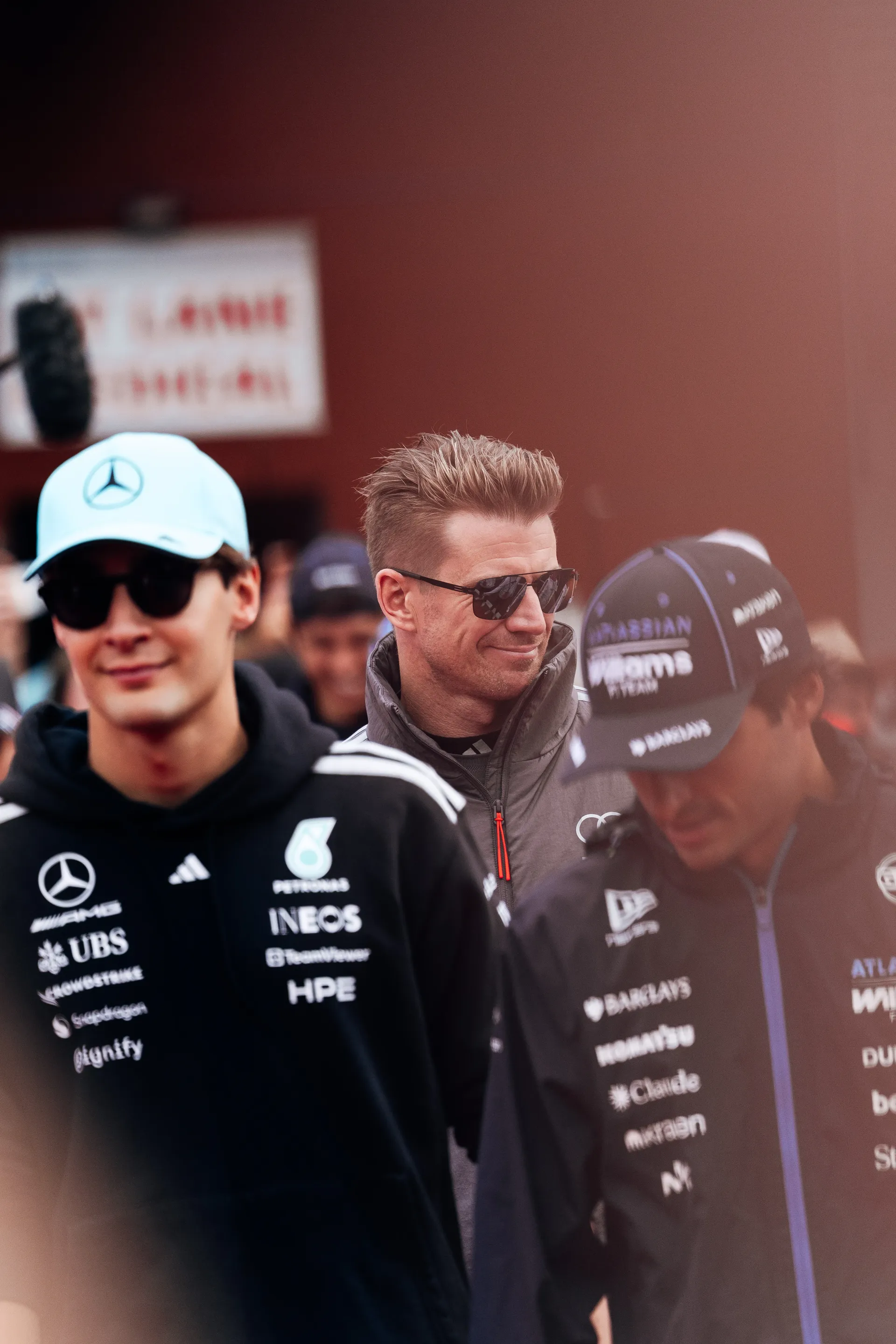 Nico Hulkenberg of Audi Revolut F1® Team walks alongside George Russell of Mercedes and Carlos Sainz of Williams during the drivers parade at Spa Francorchamps