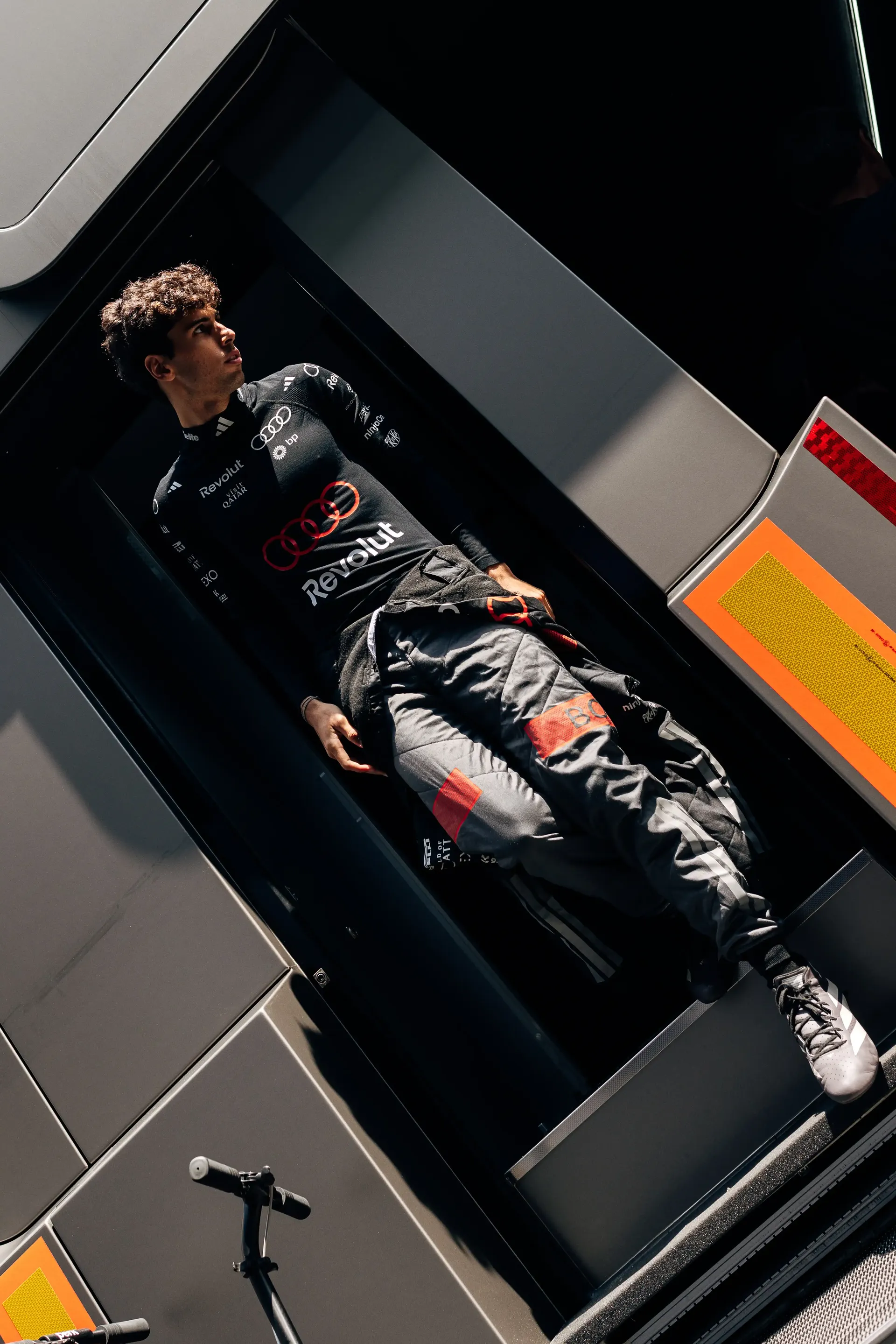 Gabriel Bortoleto walks through the Audi Revolut F1® Team garage ahead of FP1 at the Formula 1® Belgian Grand Prix in Spa-Francorchamps.