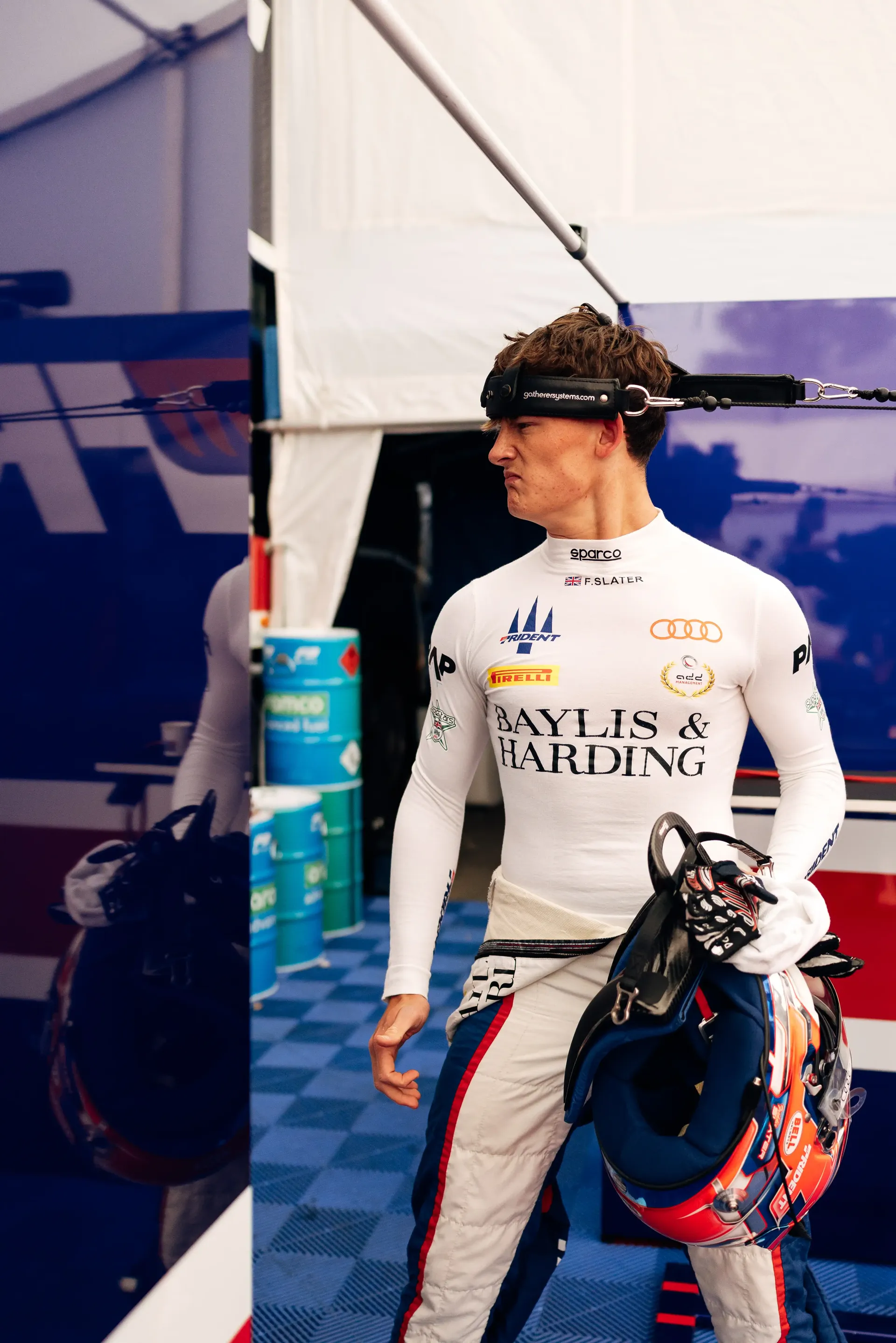 Freddie Slater, Audi F3 driver, arrives in the paddock carrying his helmet ahead of the Formula 1® Belgian Grand Prix with the Audi Revolut F1® Team.
