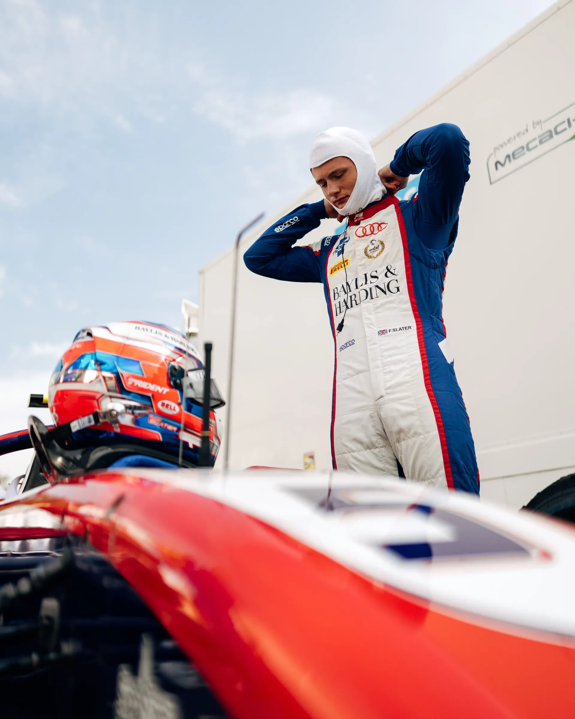 Freddie Slater prepares for his Formula 3 session beside his race car during the Formula 1® Belgian Grand Prix weekend with the Audi Revolut F1® Team.