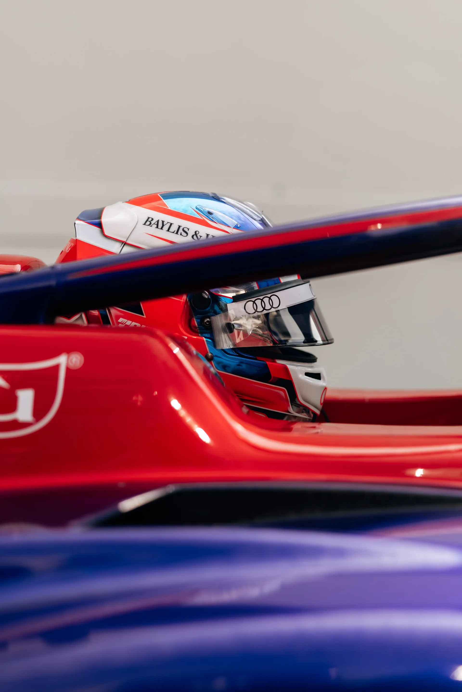 Close-up of Freddie Slater wearing his helmet inside the cockpit of his Formula 3 car during the Formula 1® Belgian Grand Prix weekend with the Audi Revolut F1® Team.
