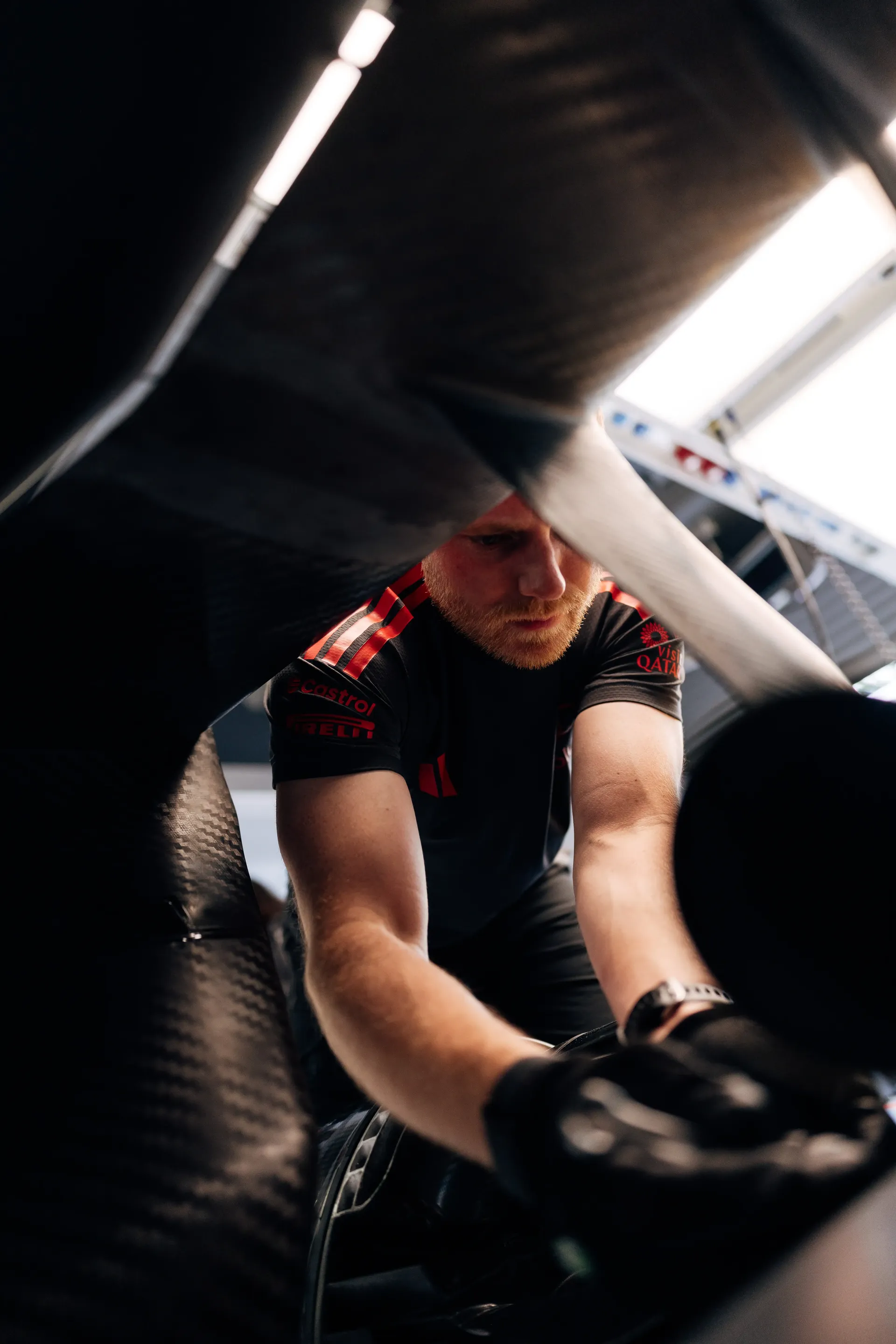 Audi Revolut F1® Team mechanic works on the Formula 1® car inside the Audi Revolut F1® Team garage at Spa-Francorchamps.
