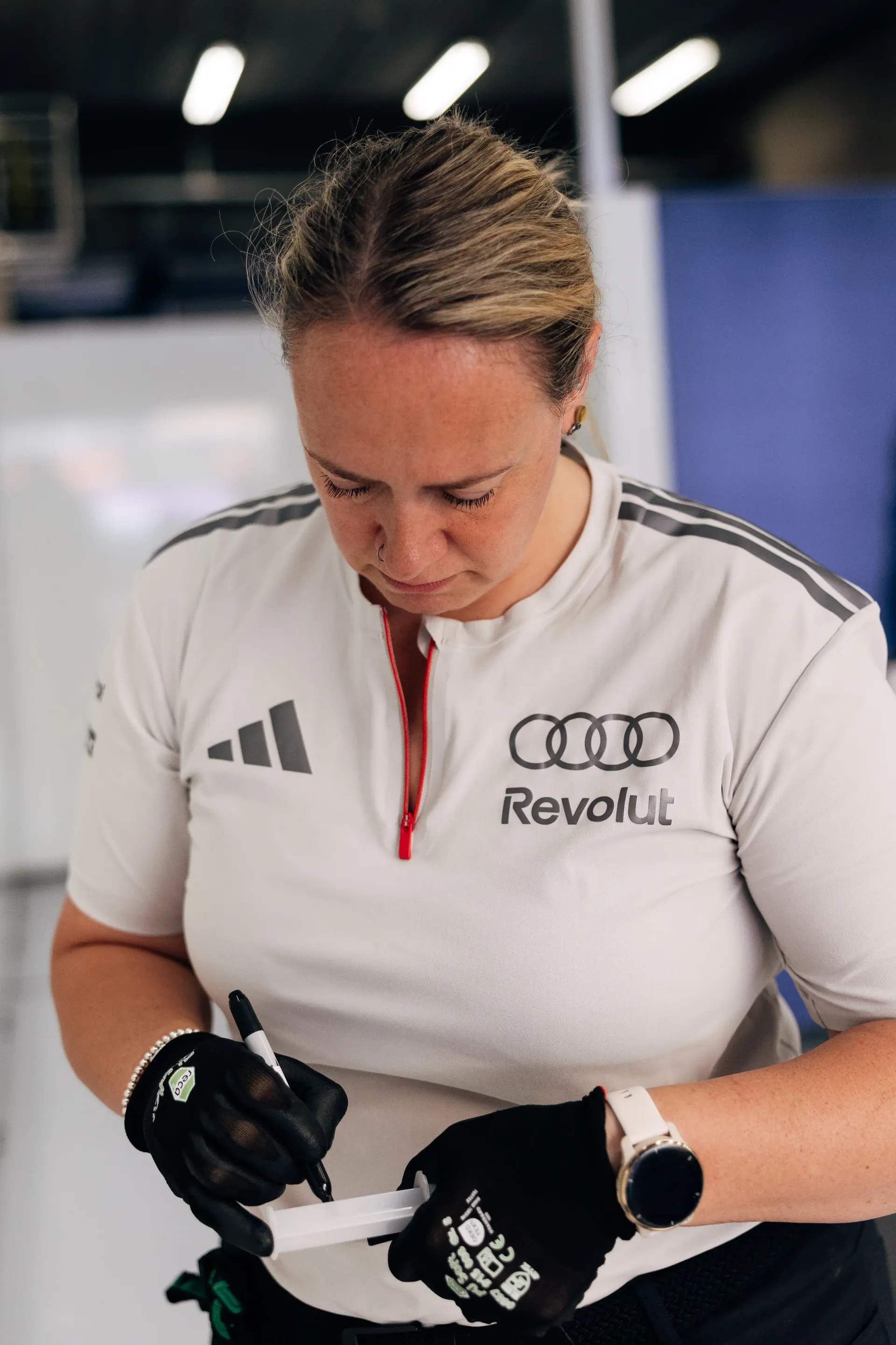 Audi Revolut F1® Team engineer prepares equipment inside the Audi Revolut F1® Team garage ahead of Friday track action.