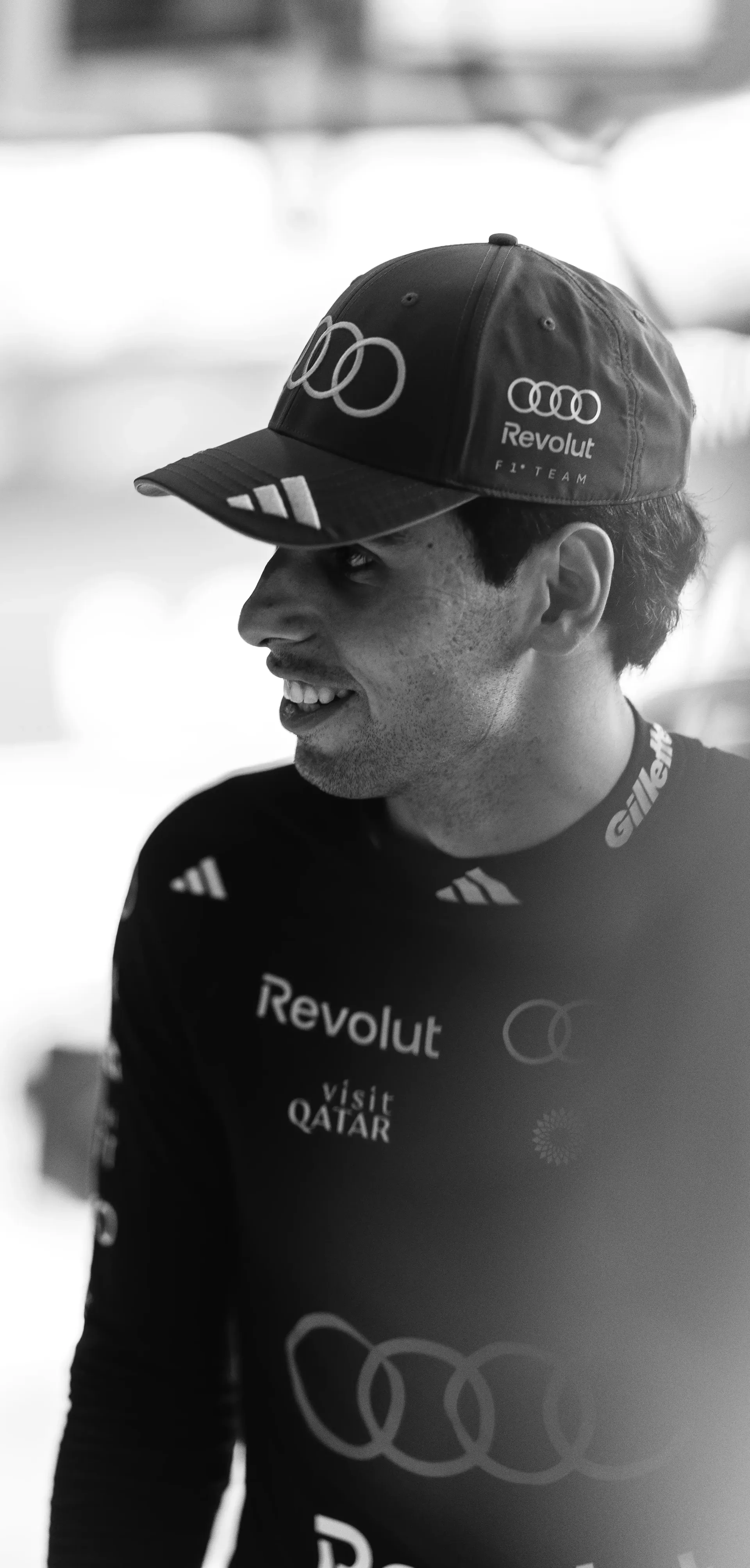 Black and white Shot of Gabriel Bortoleto driver at the Audi Revolut F1® Team inside the garage at the Belgian Grand Prix 2026