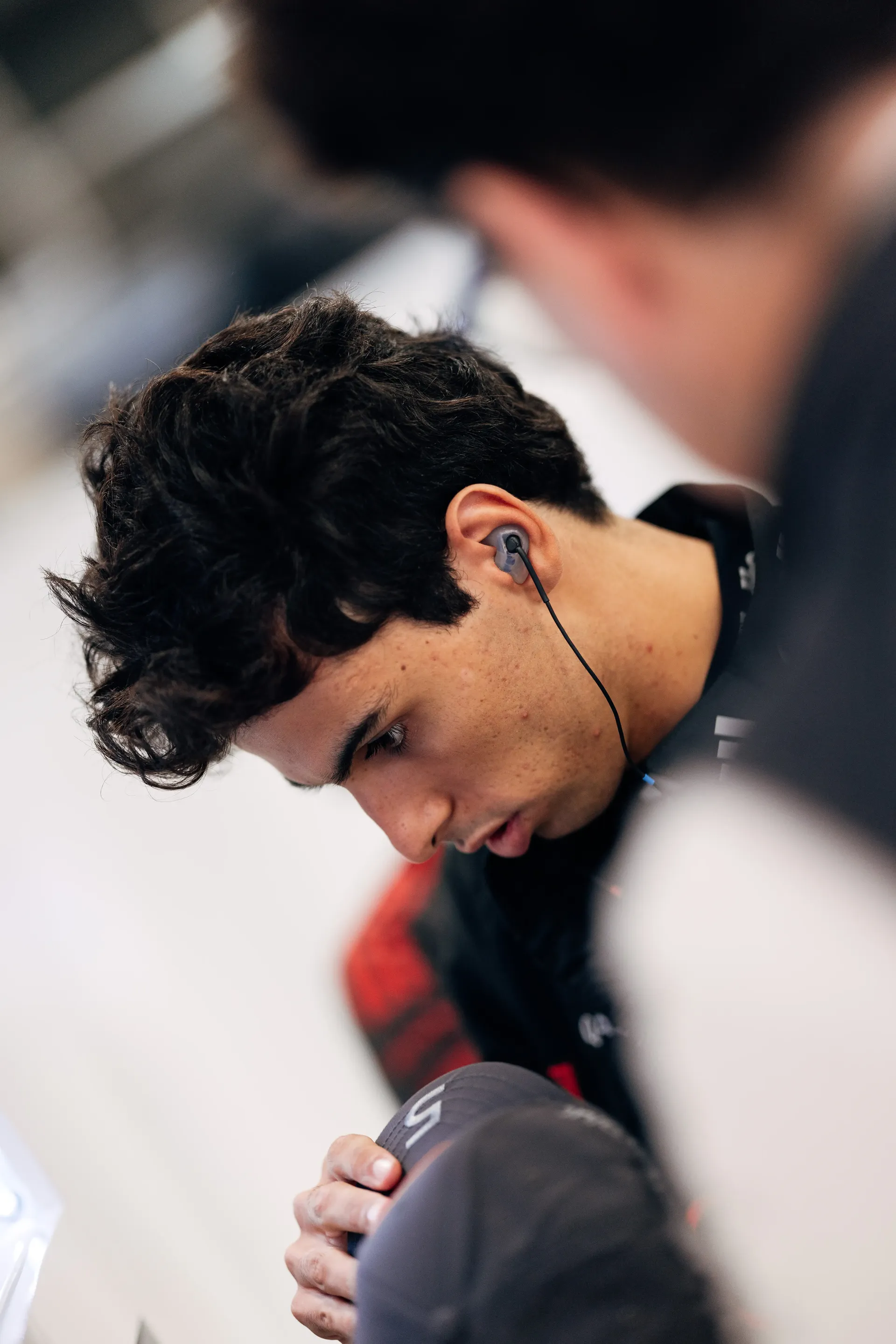 Close up of Gabriel Bortoleto driver at Audi Revolut F1® Team inside the garage at the Belgian Grand Prix 2026