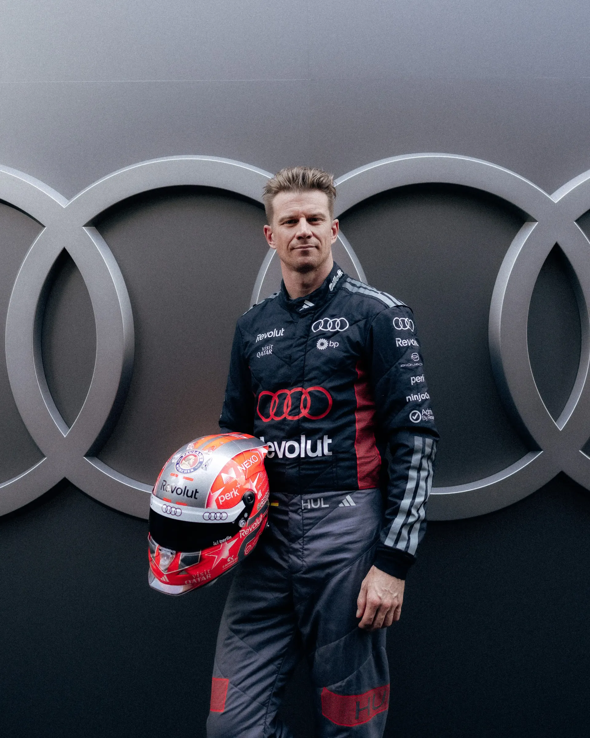 Nico Hulkenberg poses with his special Belgian Grand Prix helmet at the Audi Revolut F1® Team garage ahead of the Formula 1® Belgian Grand Prix weekend.