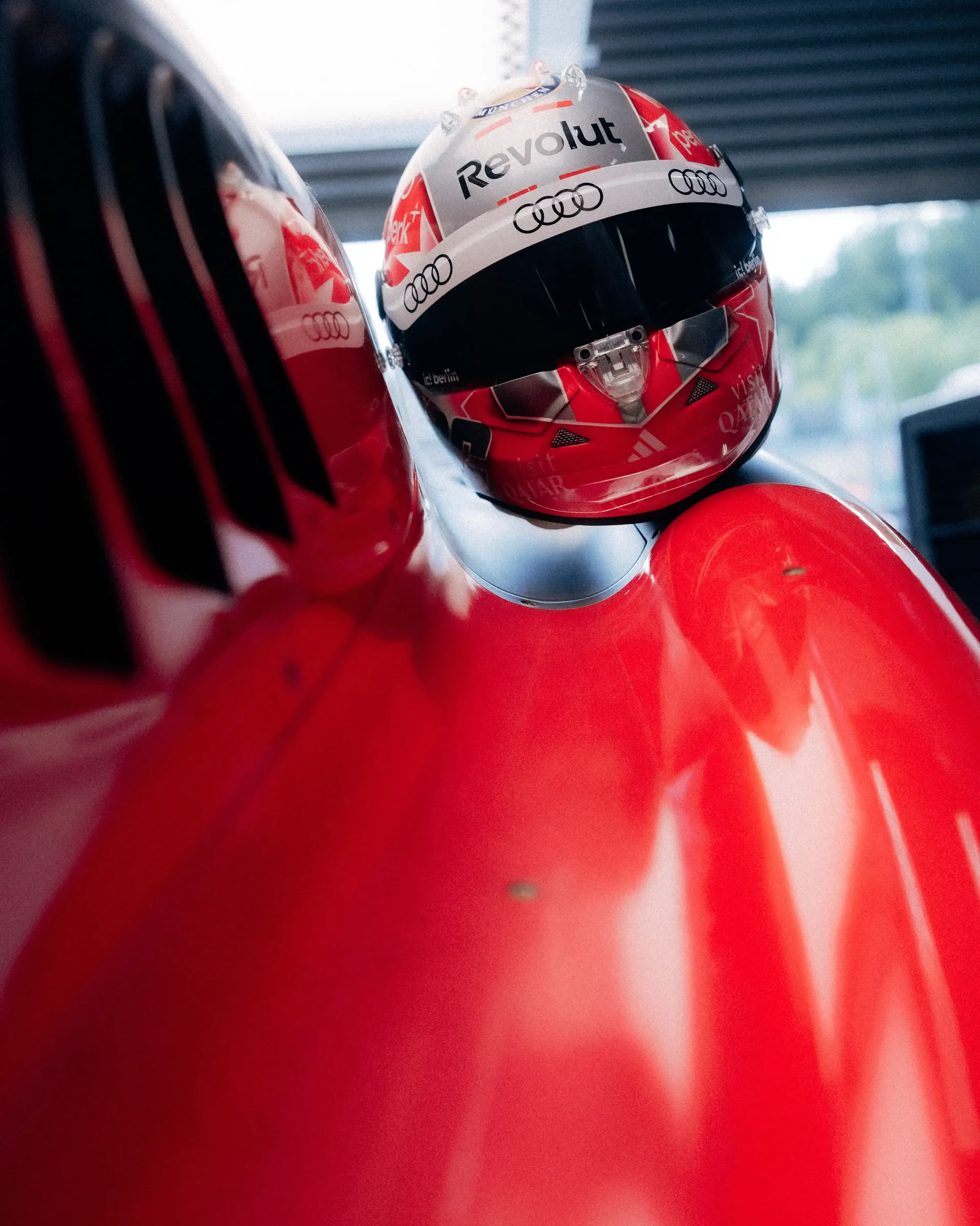 Nicoi Hulkenbergs new Audi Revolut F1® Team helmet leaning on the Audi R26 side wing