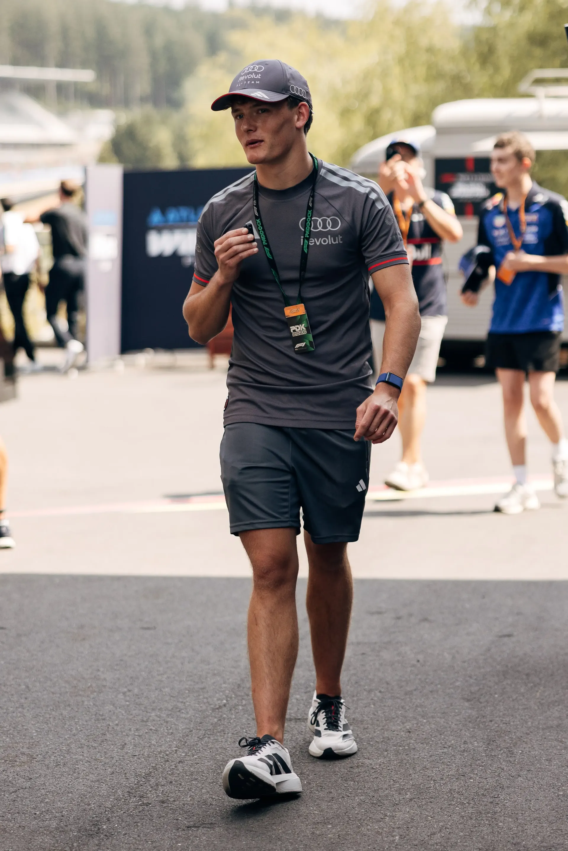 Audi Revolut F1® Team F3 driver Freddie Slater walking through the Spa-Francorchamps paddock during Thursday preparations for the Belgian Grand Prix.