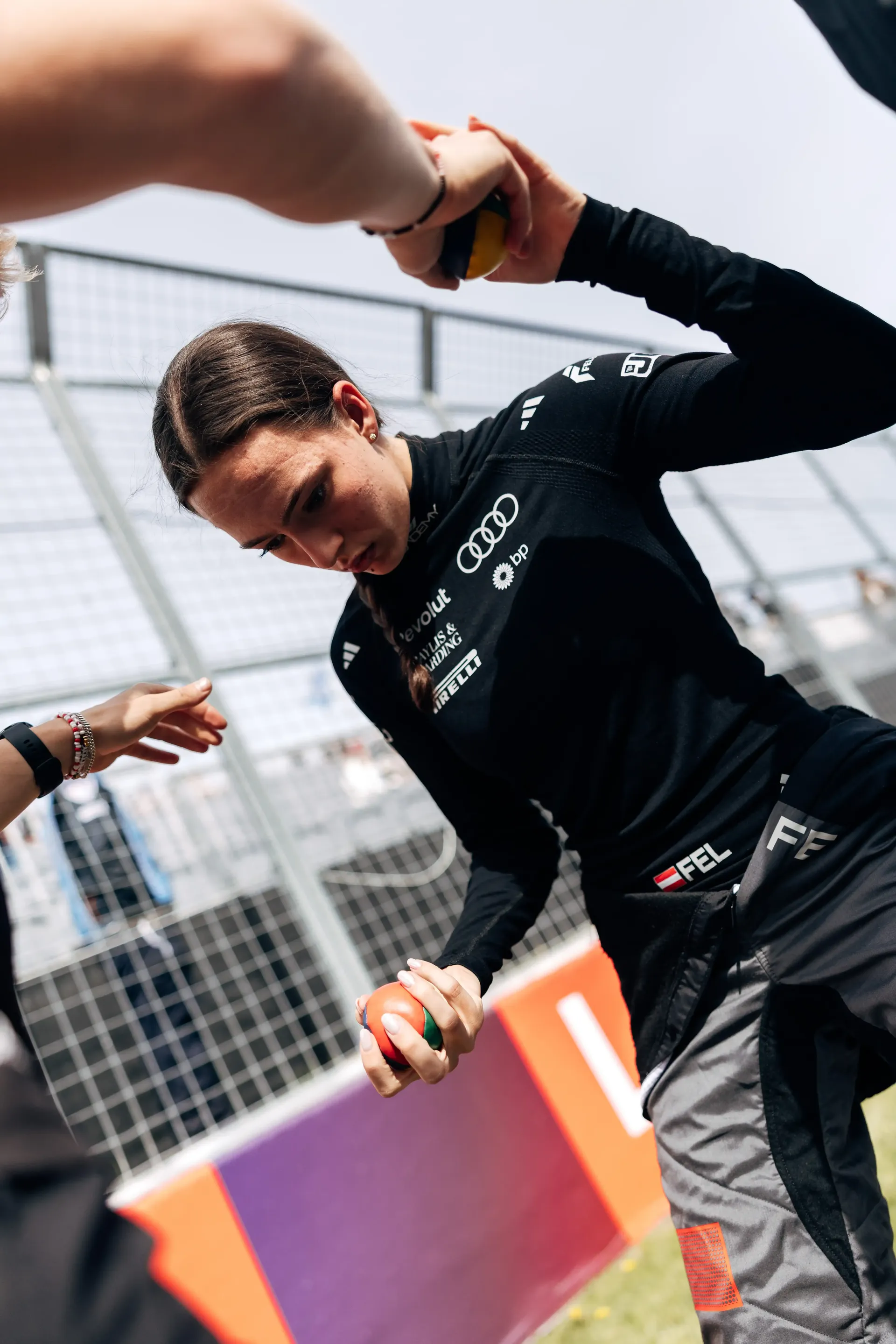 Emma Felbermayr driver at the Audi Revolut F1® Team Academy walking and holding hands along the track side at the Canadian Grand Prix 2026