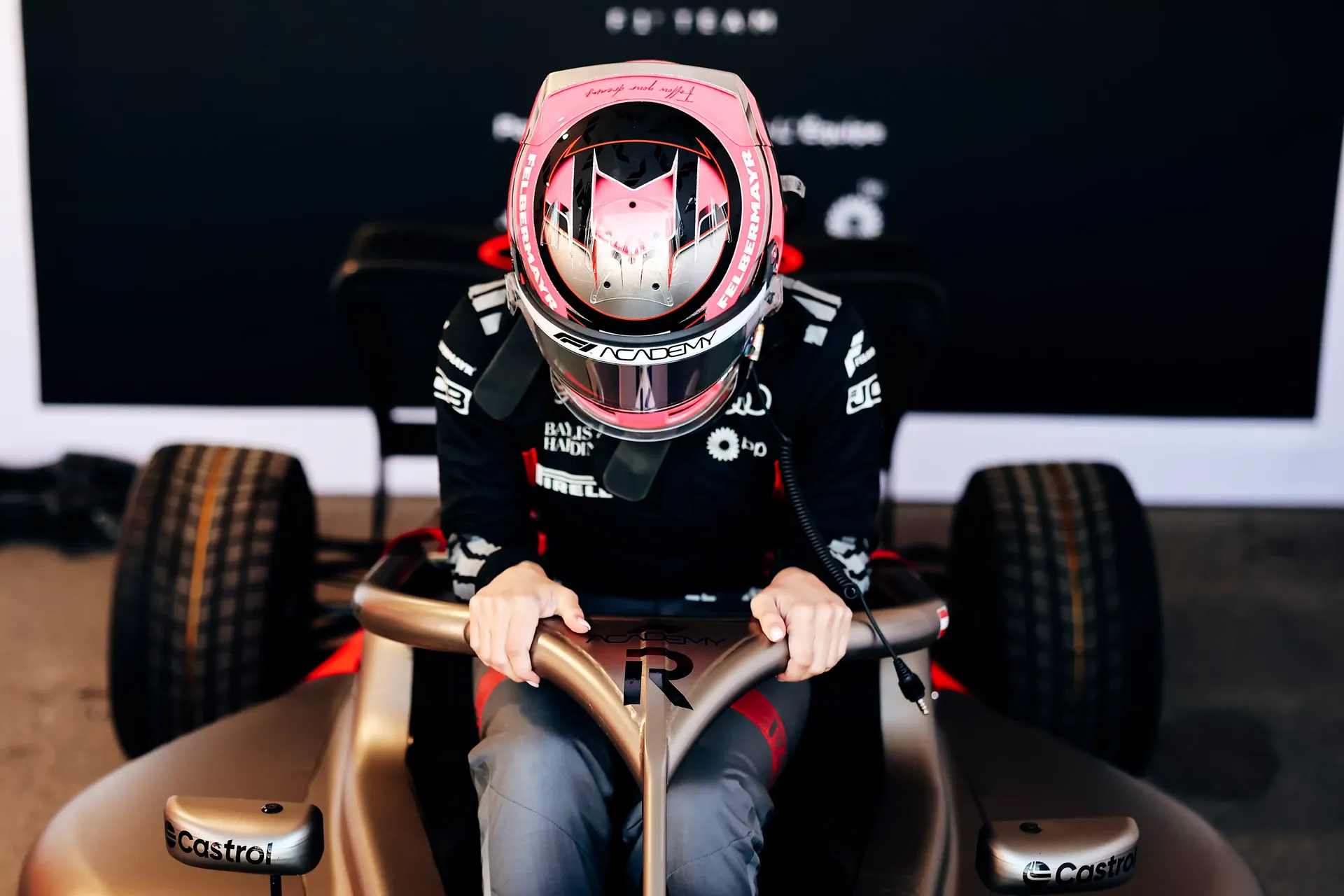 Emma jumping into the cockpit of the Audi Revolut F1® Team Academy car at the Canada Grand Prix 2026